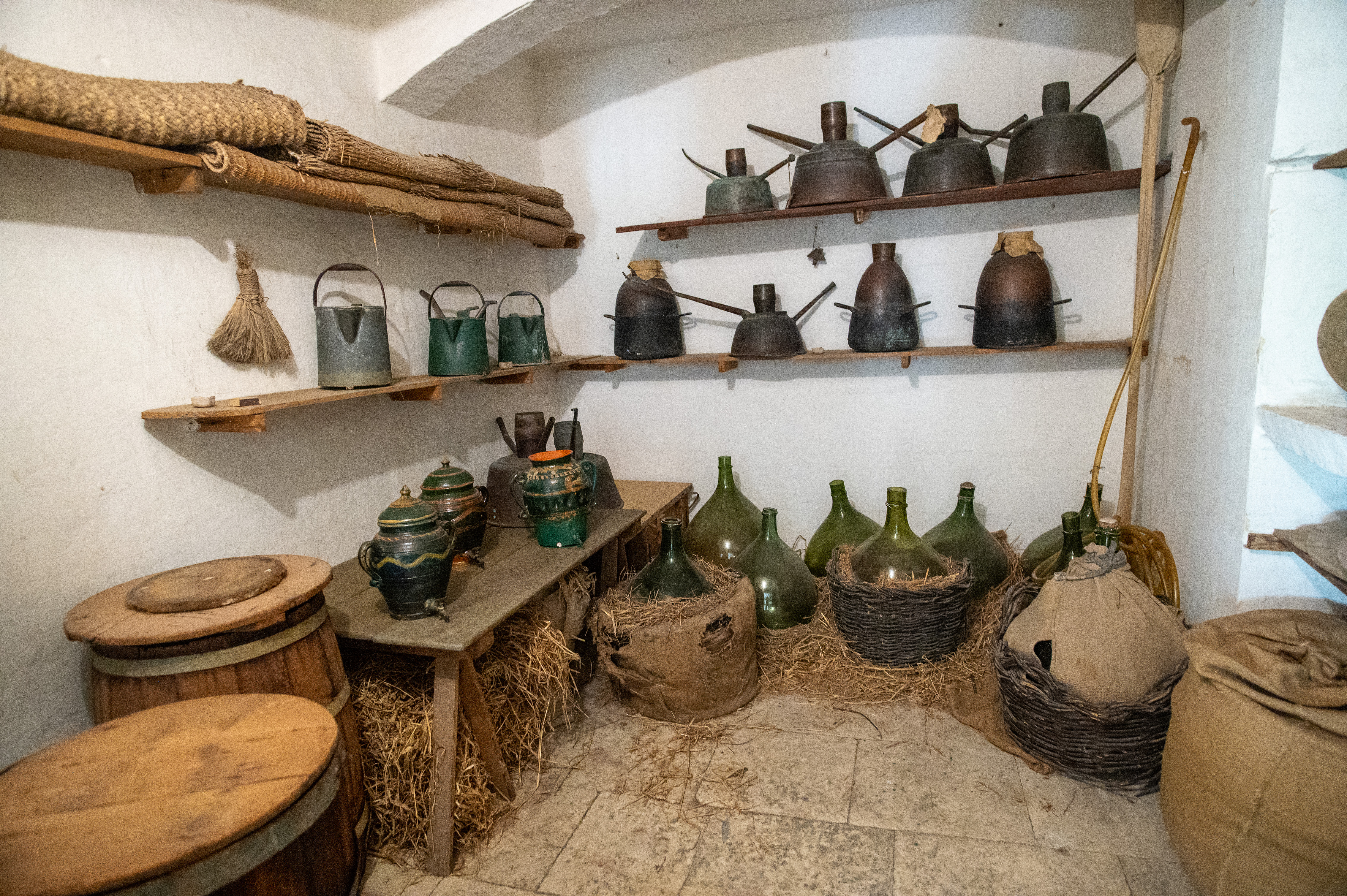 storage area, showcasing tools and containers used for preserving and handling foodstuffs