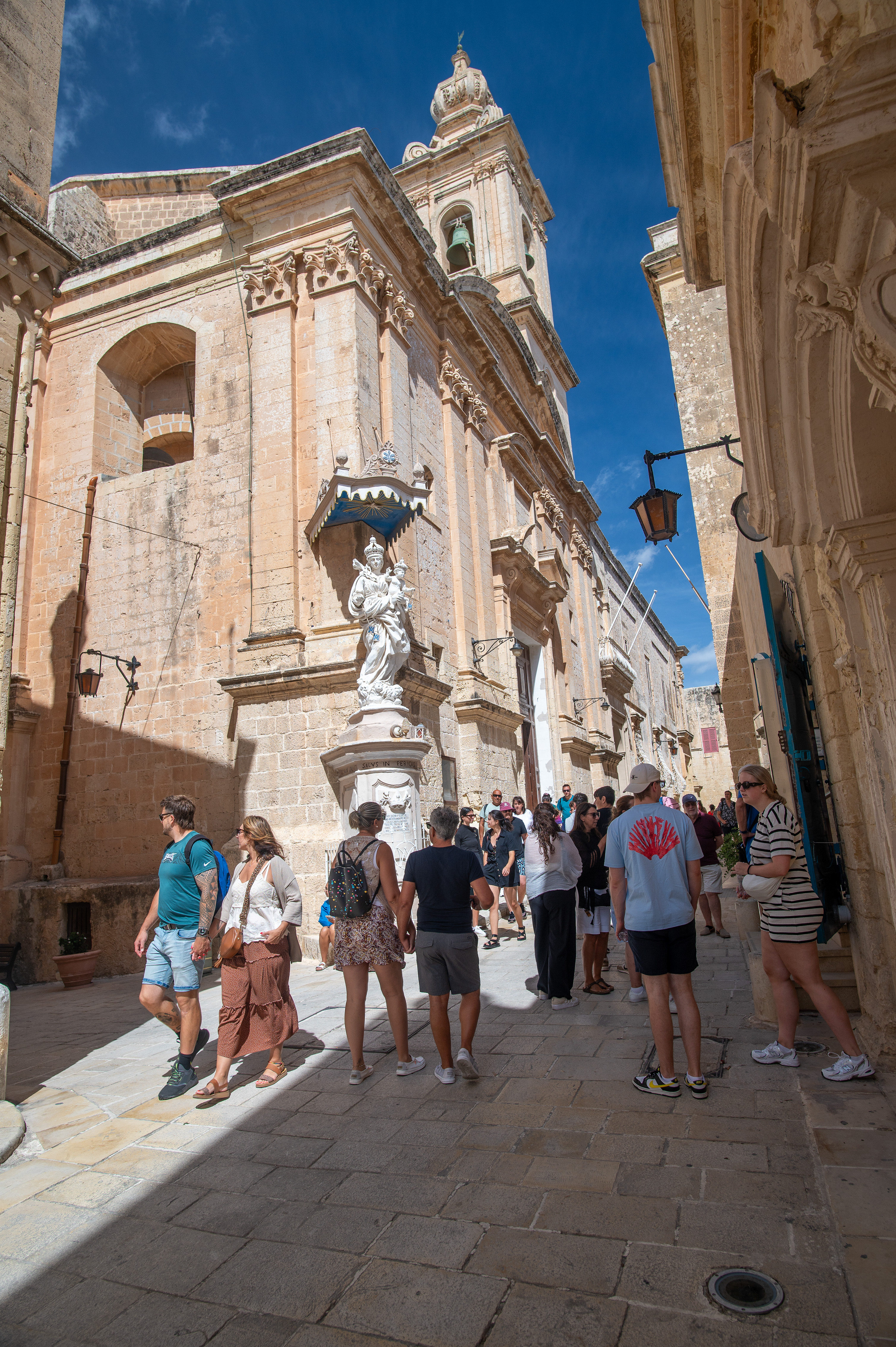 people gathered in a narrow street