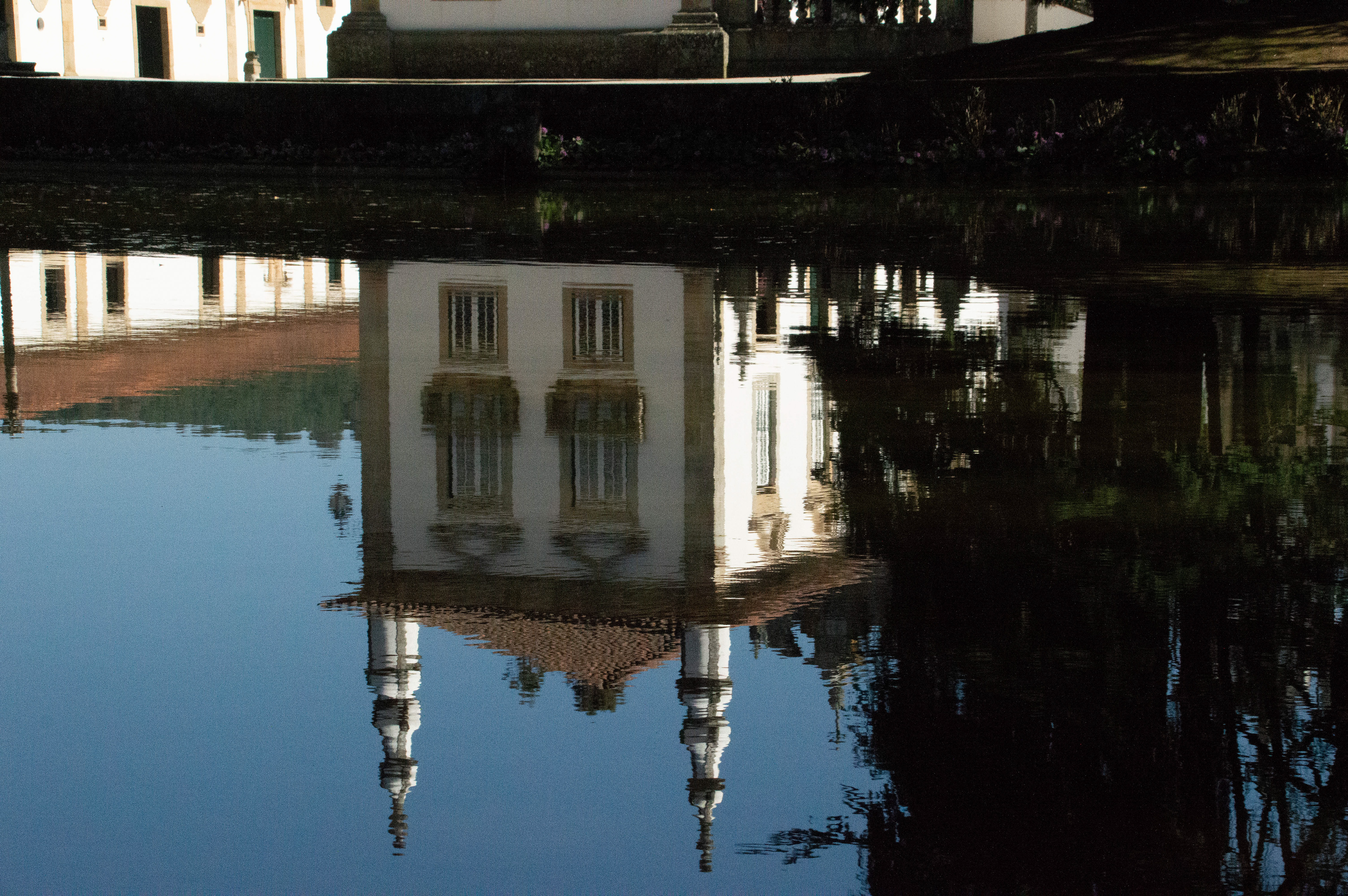 building reflected in calm water