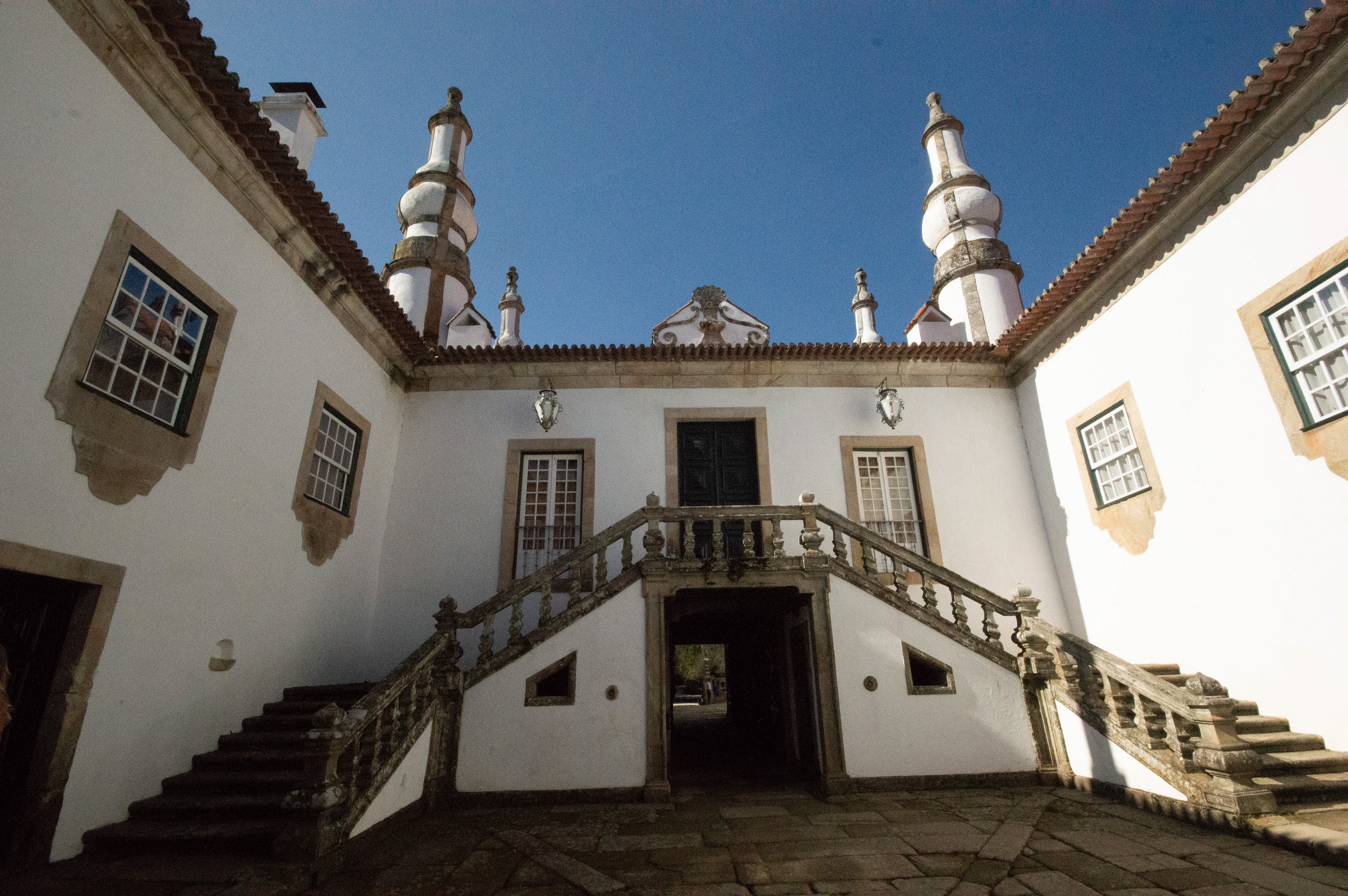architectural structure with a central staircase leading to an upper level