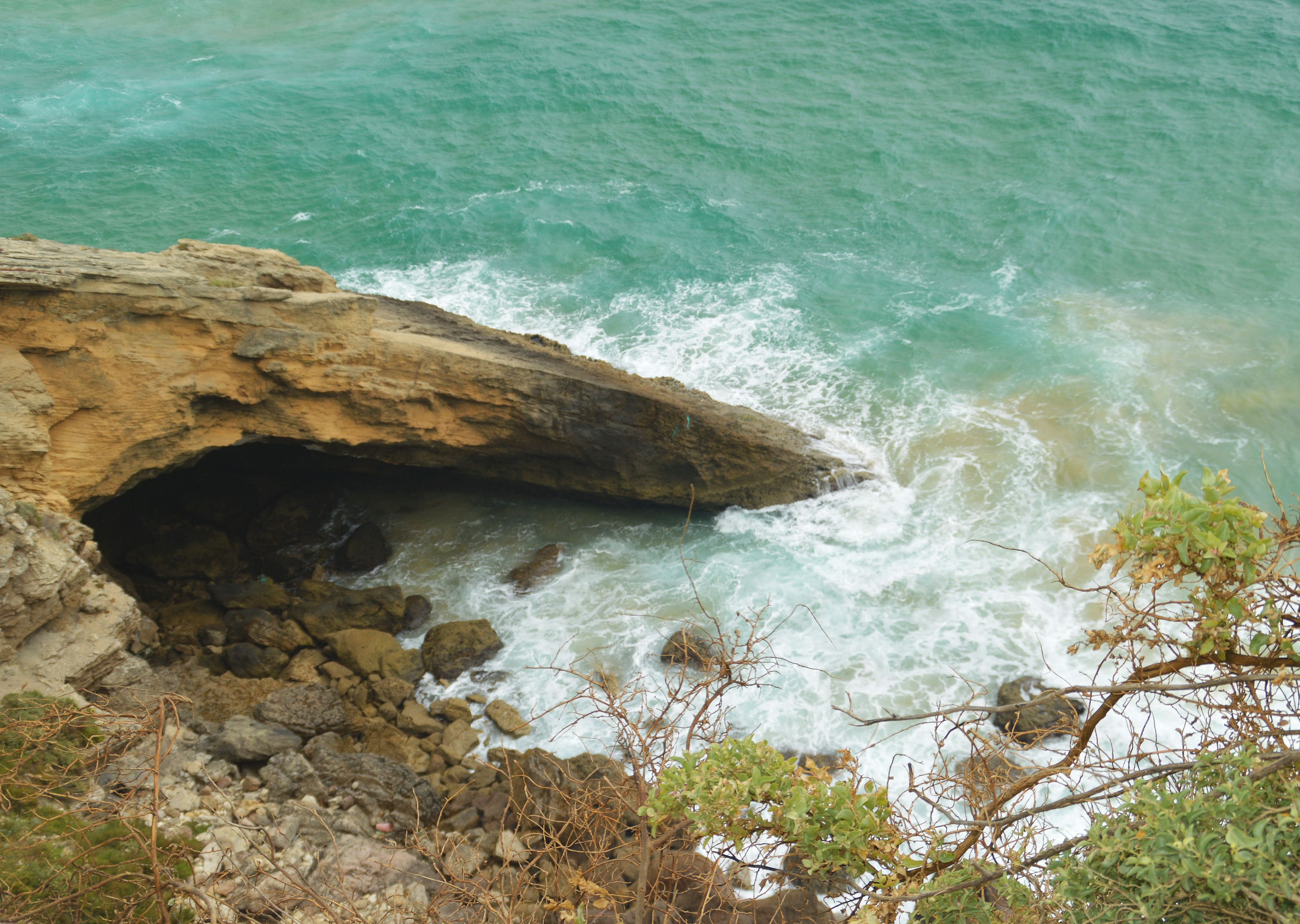 rocky coastline with waves crashing against it