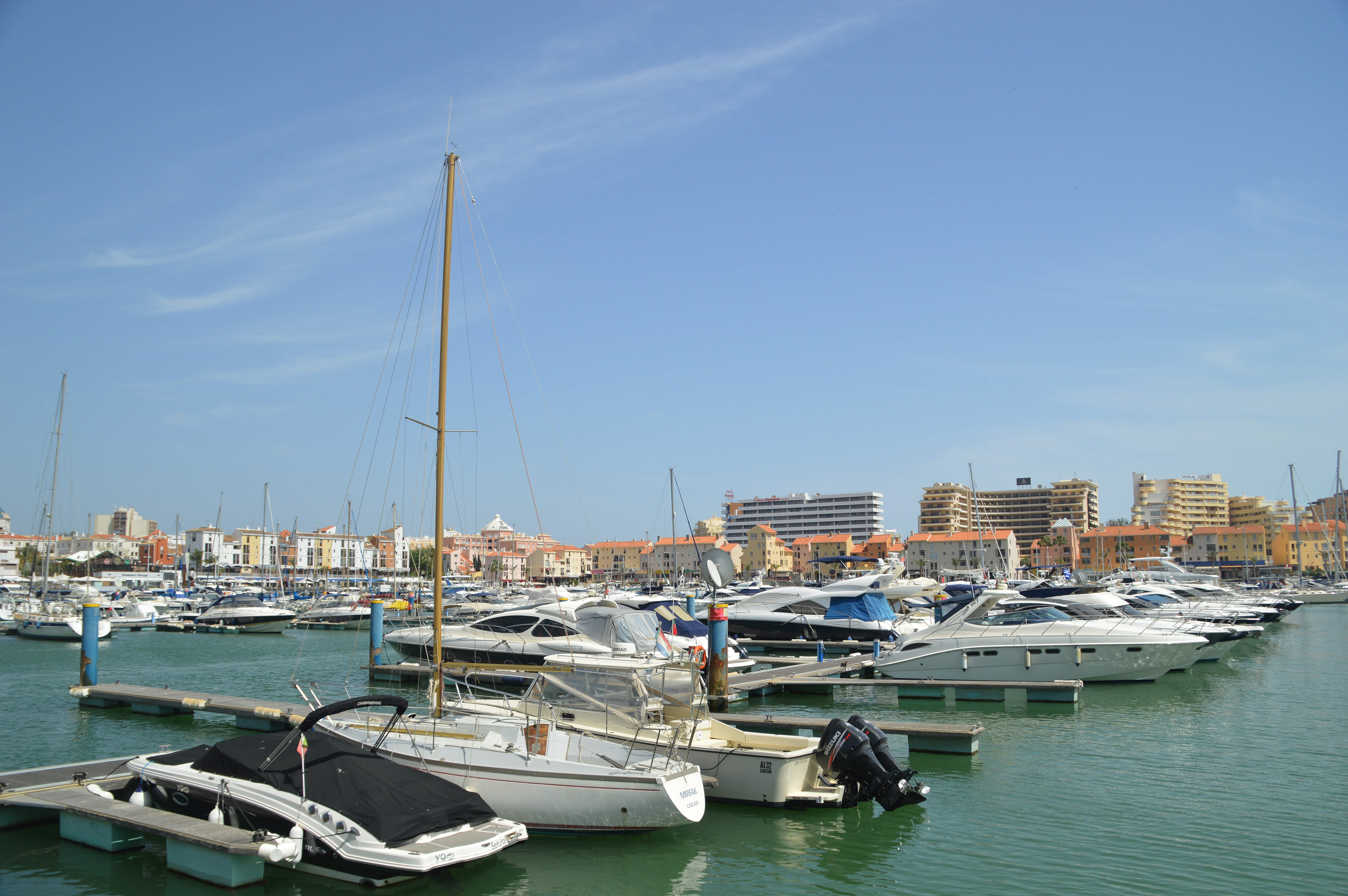 boats and yachts docked at piers