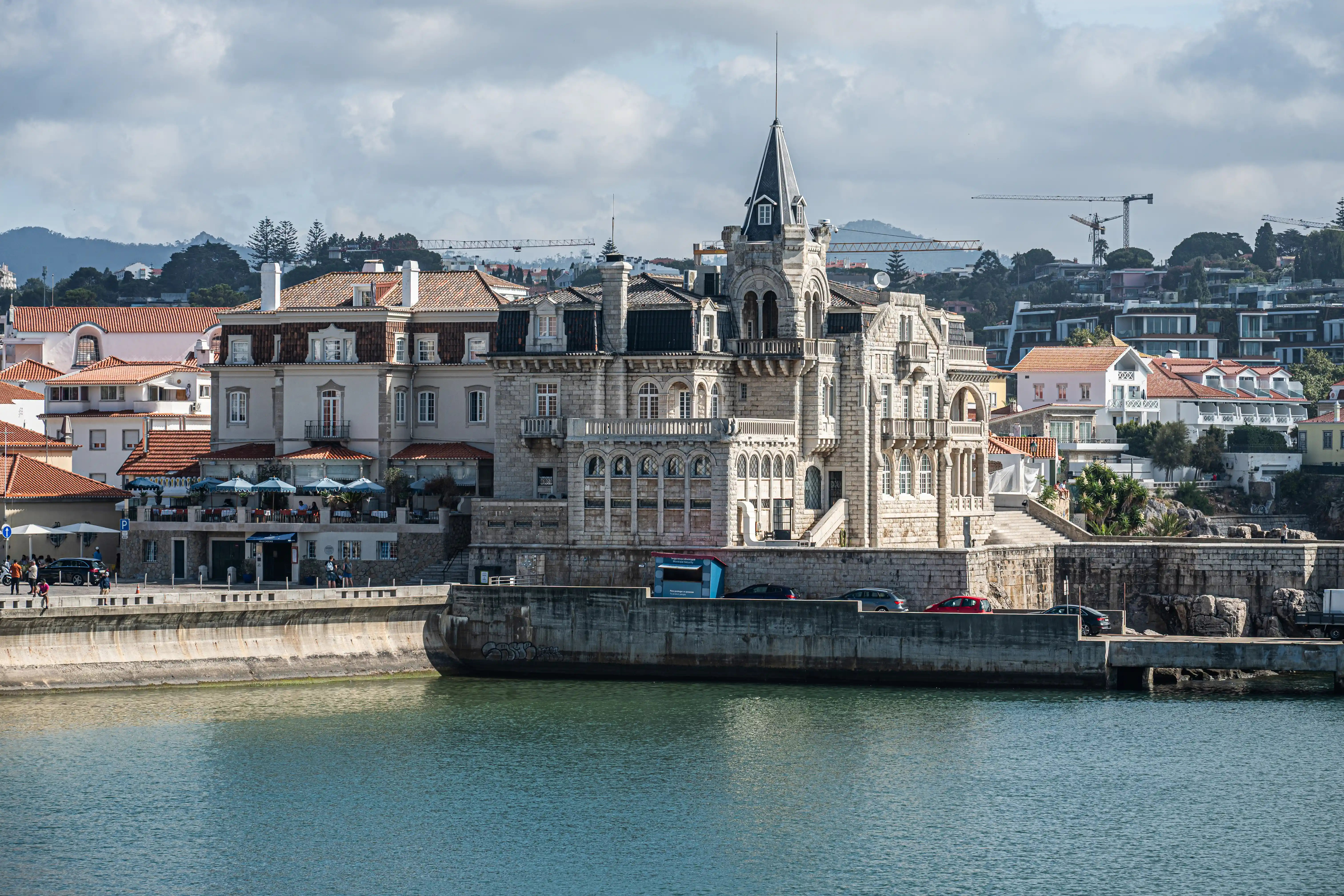 A detailed view of the grand presidential palace building in Cascais, Portugal, from across the bay.