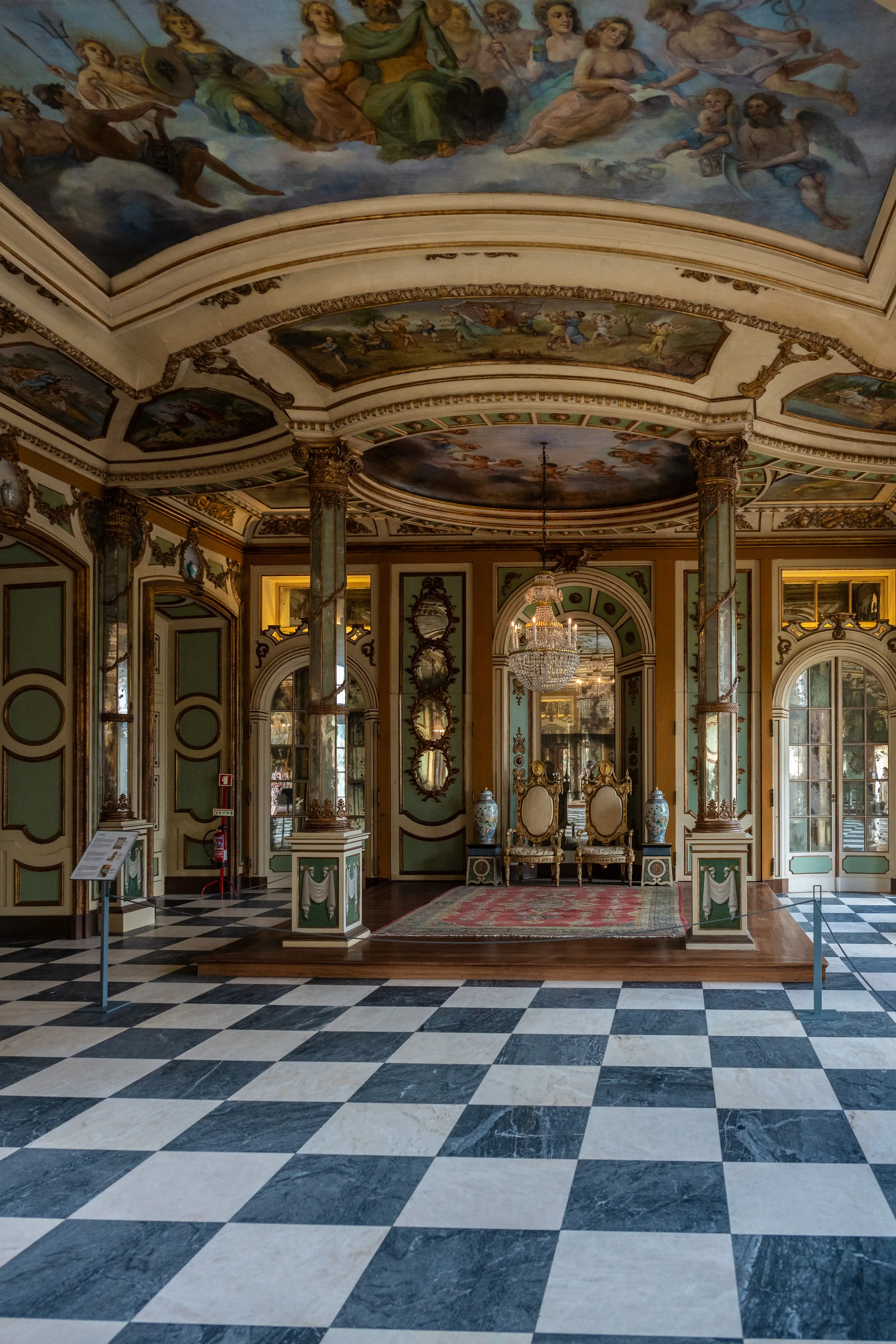Opulent Rococo Salon with Painted Ceiling and Ornate Furnishings
