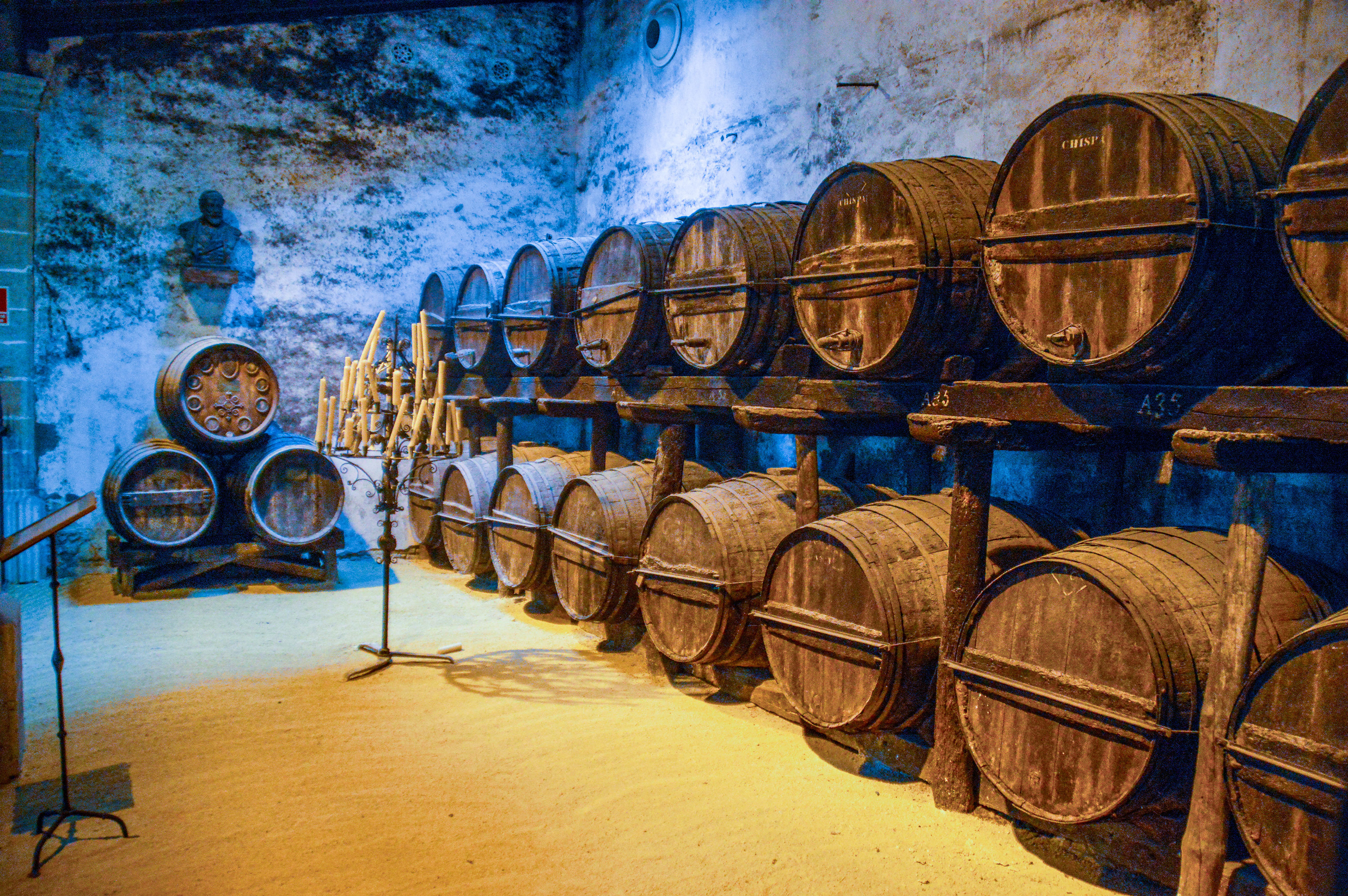 wooden barrels stacked in rows