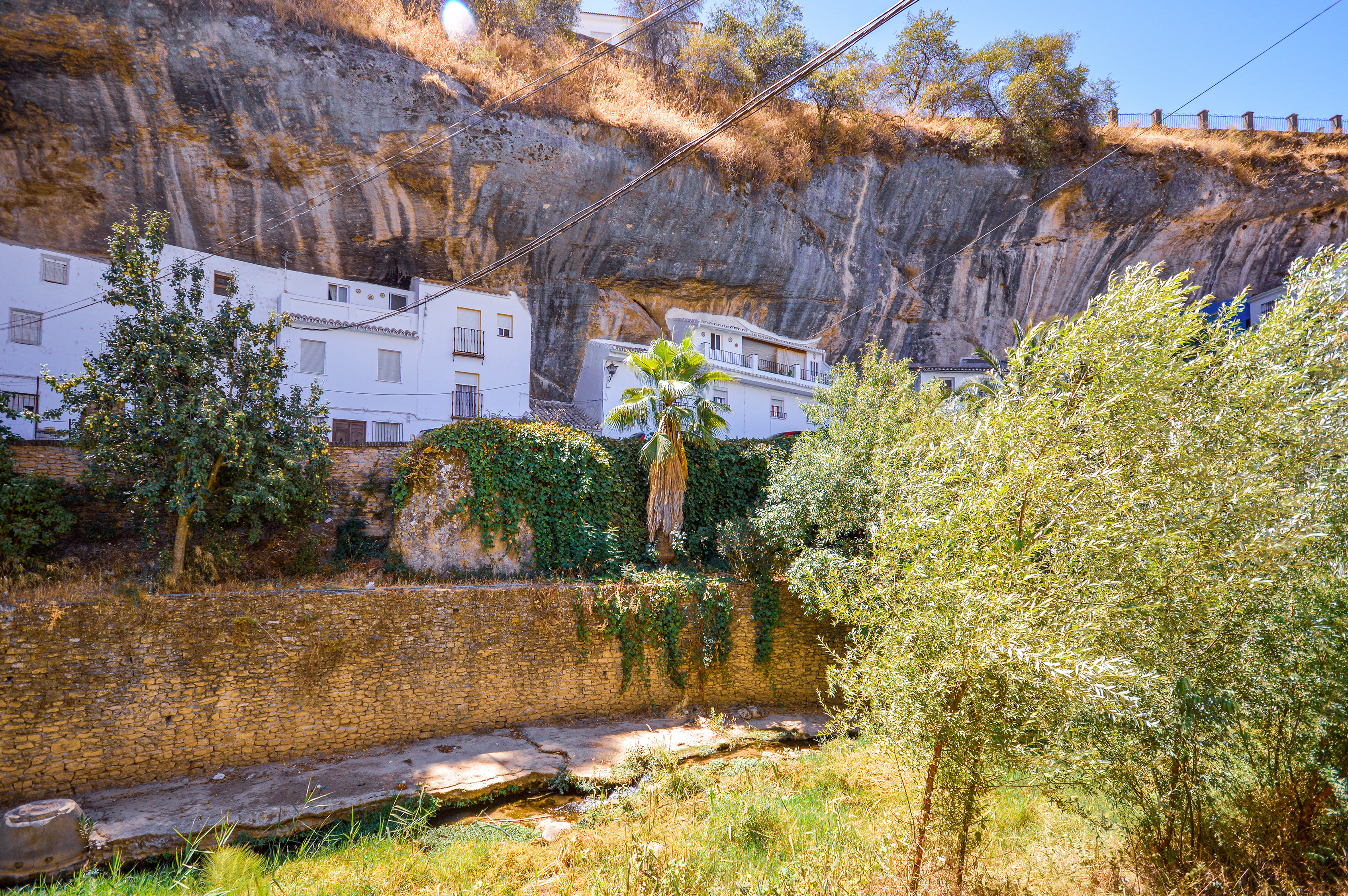 small village nestled against a rocky cliff