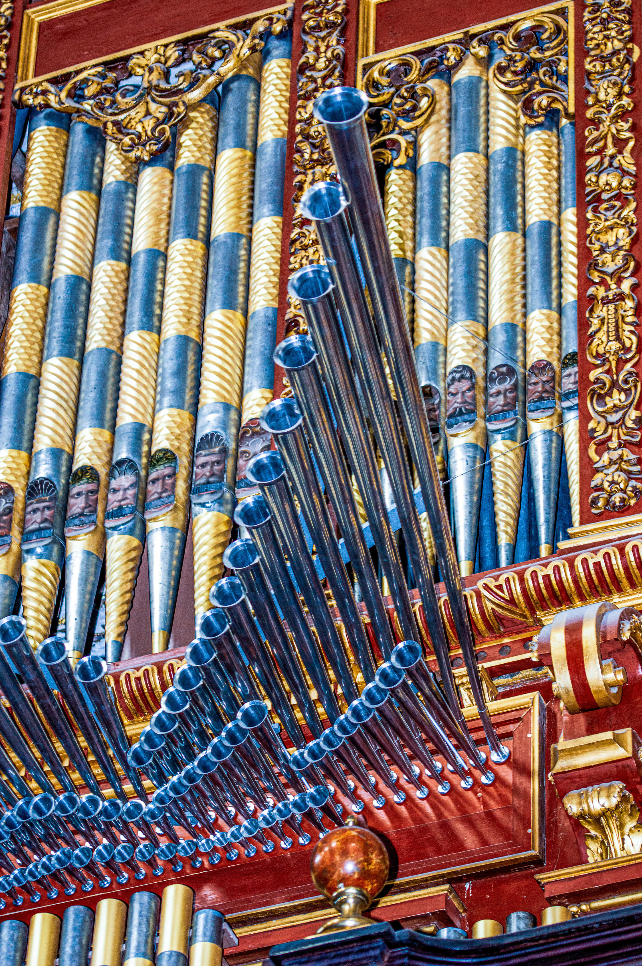 intricate and ornate pipes of a pipe organ