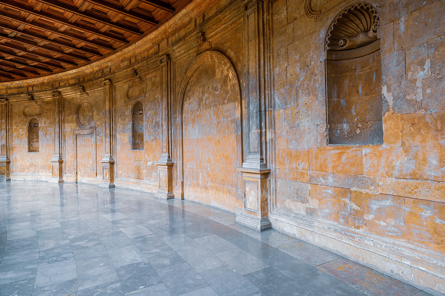 stone walls and a wooden ceiling