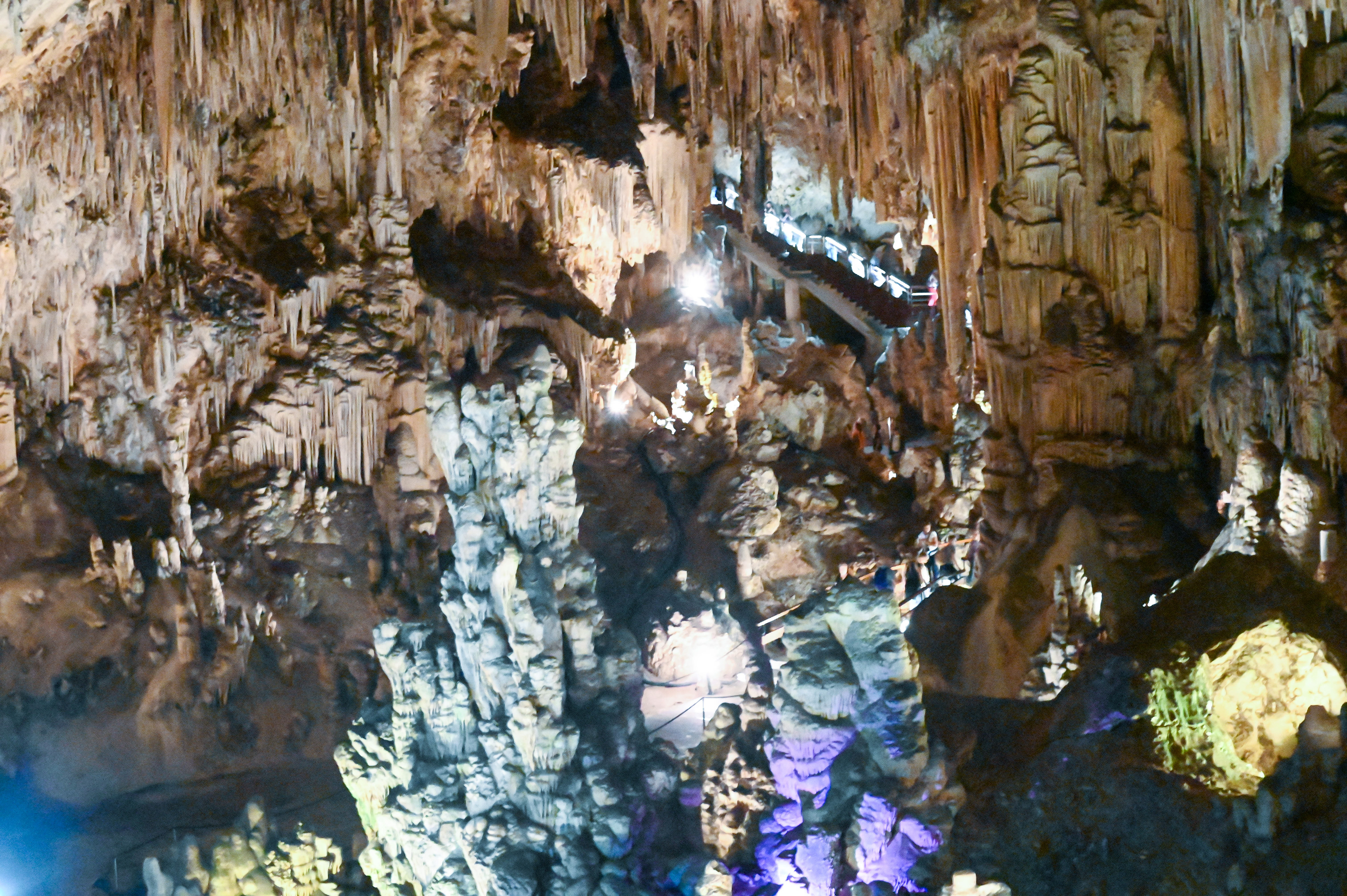 The cave is illuminated by artificial lighting