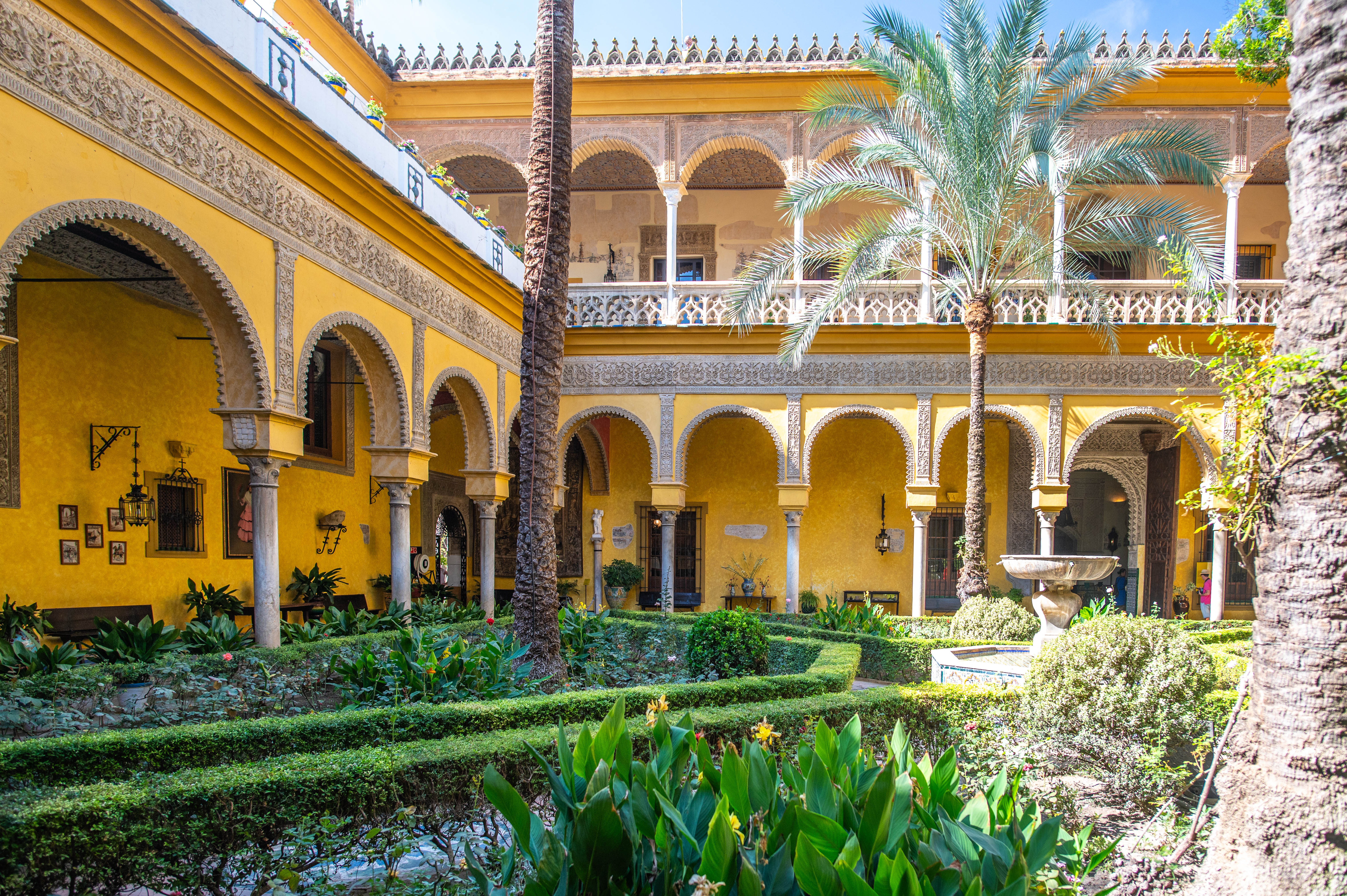 a beautiful courtyard with yellow walls