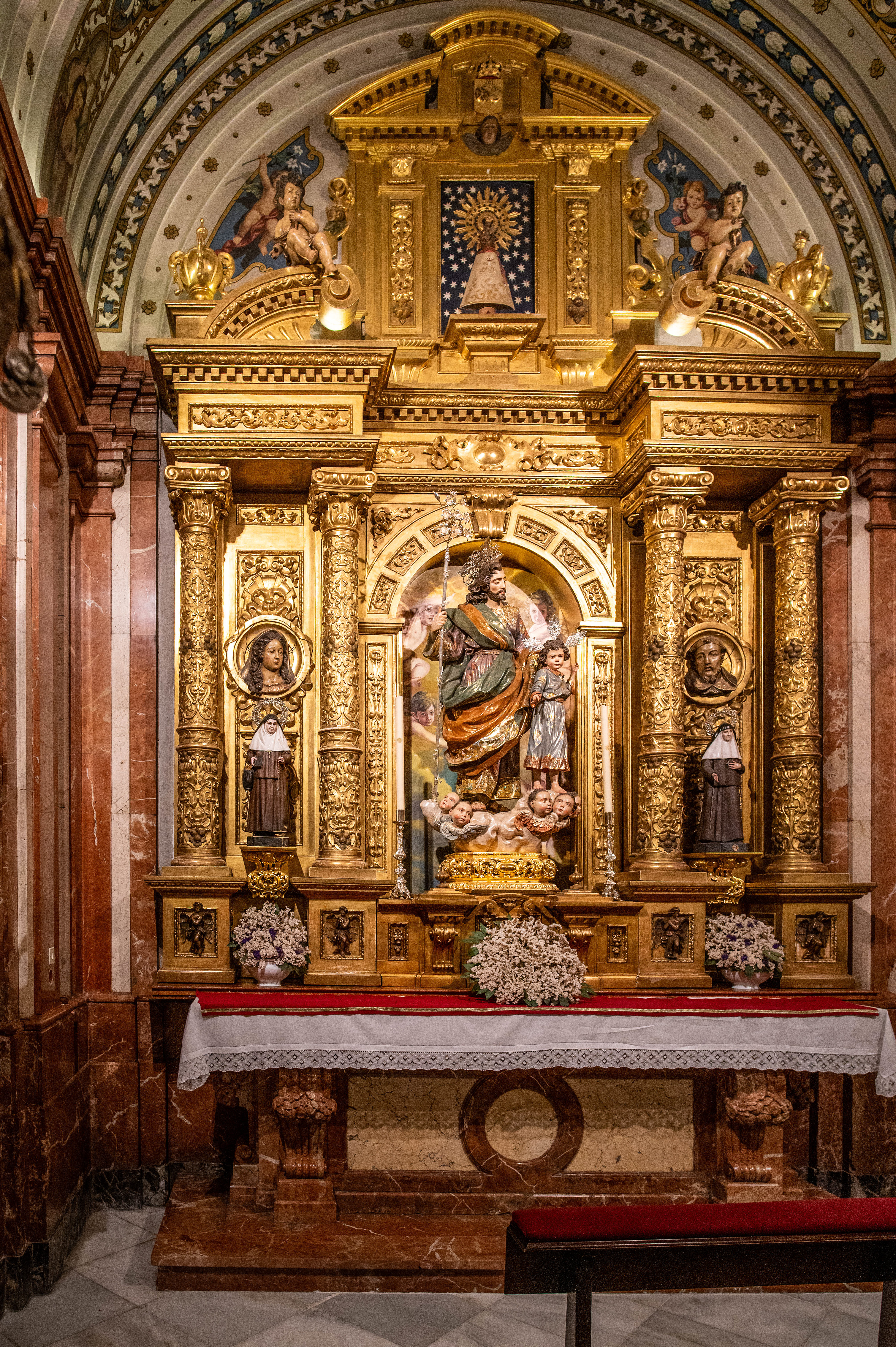 gold detailing and religious statues