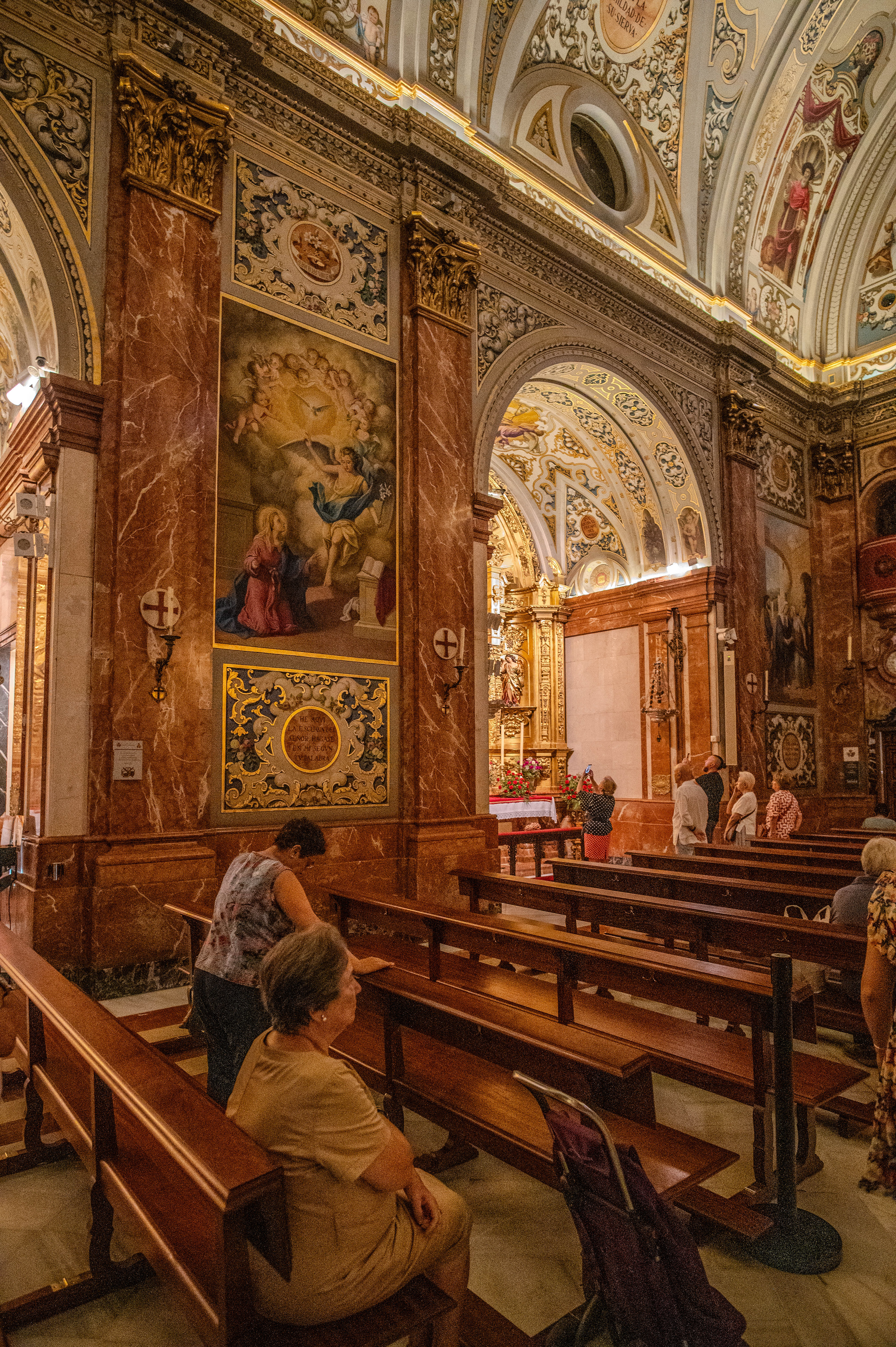 people are seated in the pews