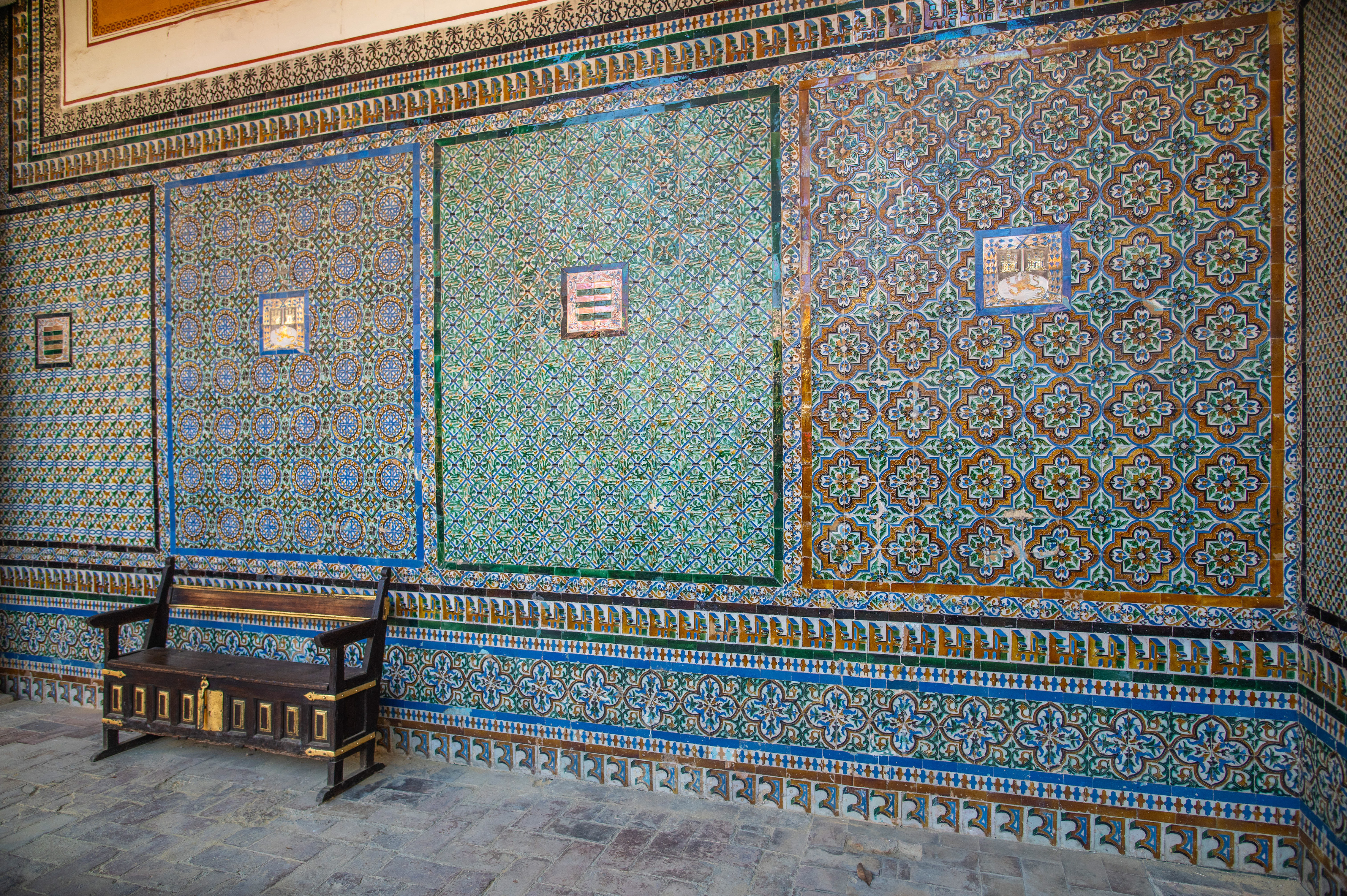 an intricately tiled wall with elaborate geometric and floral patterns