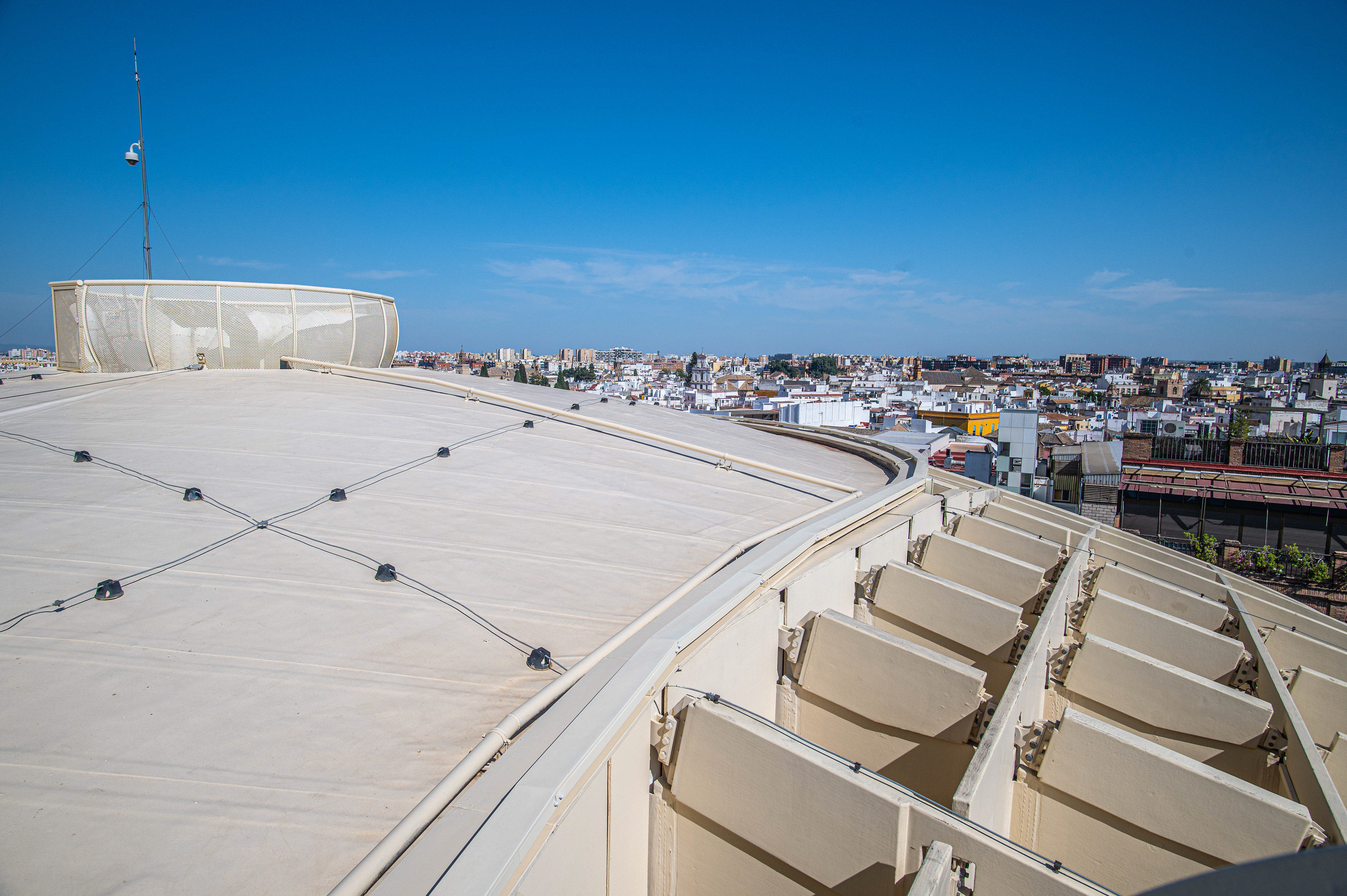 open rooftop area with a clear view of a cityscape in the background