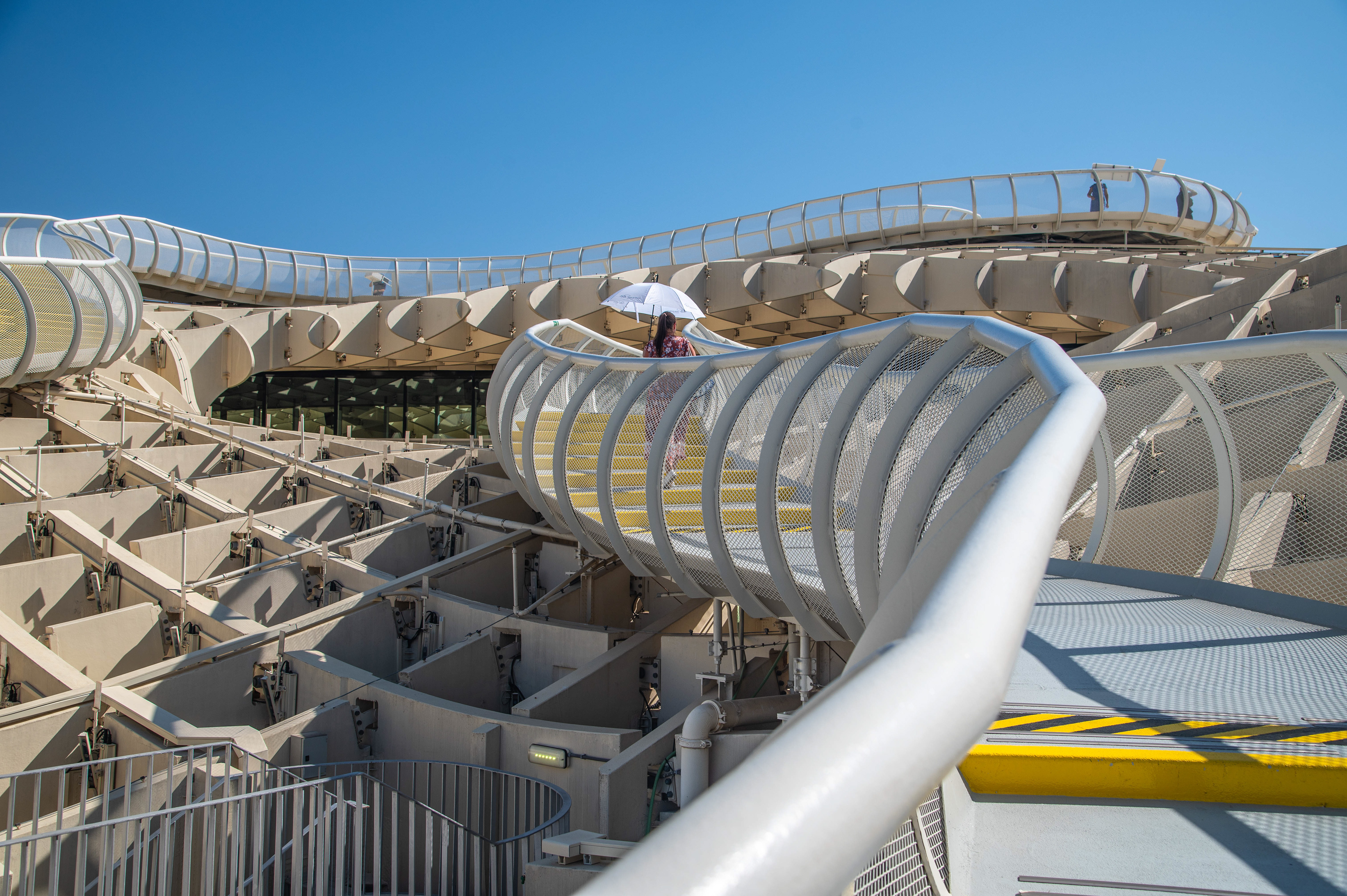 People are seen walking on the upper-level ramp