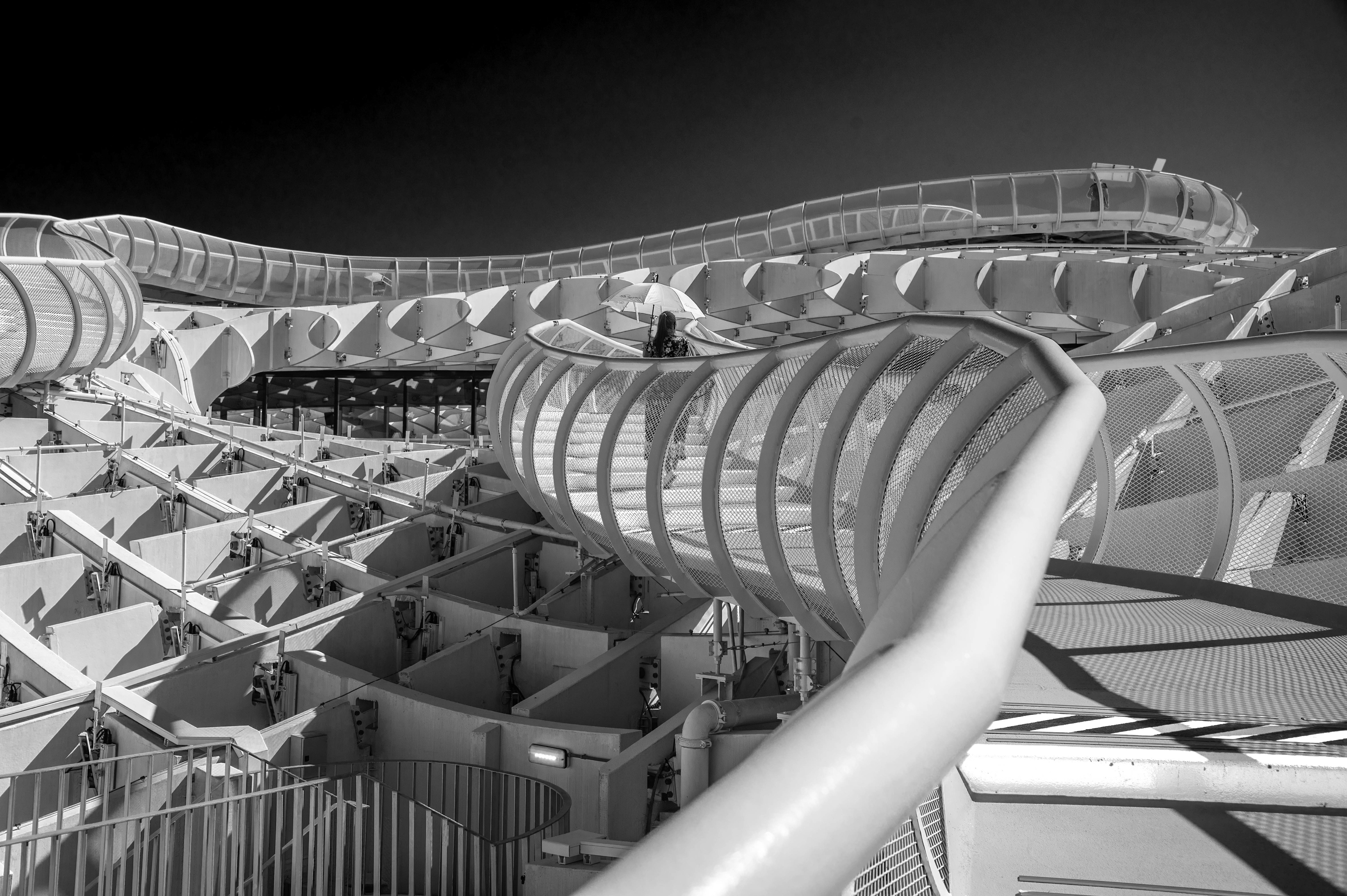 People are seen walking on the upper-level ramp