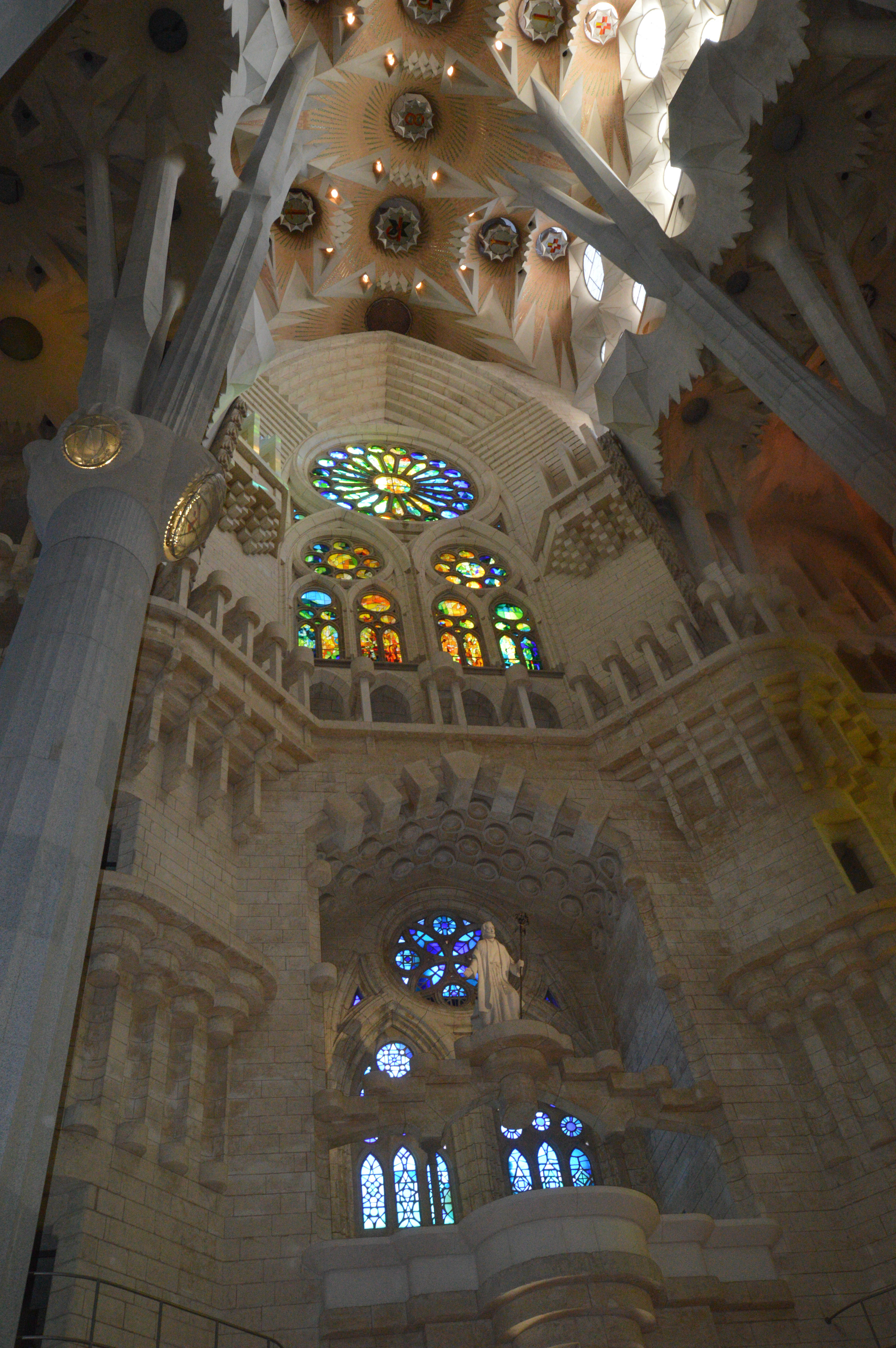 The ceiling showcases a complex design with various geometric patterns and symbols