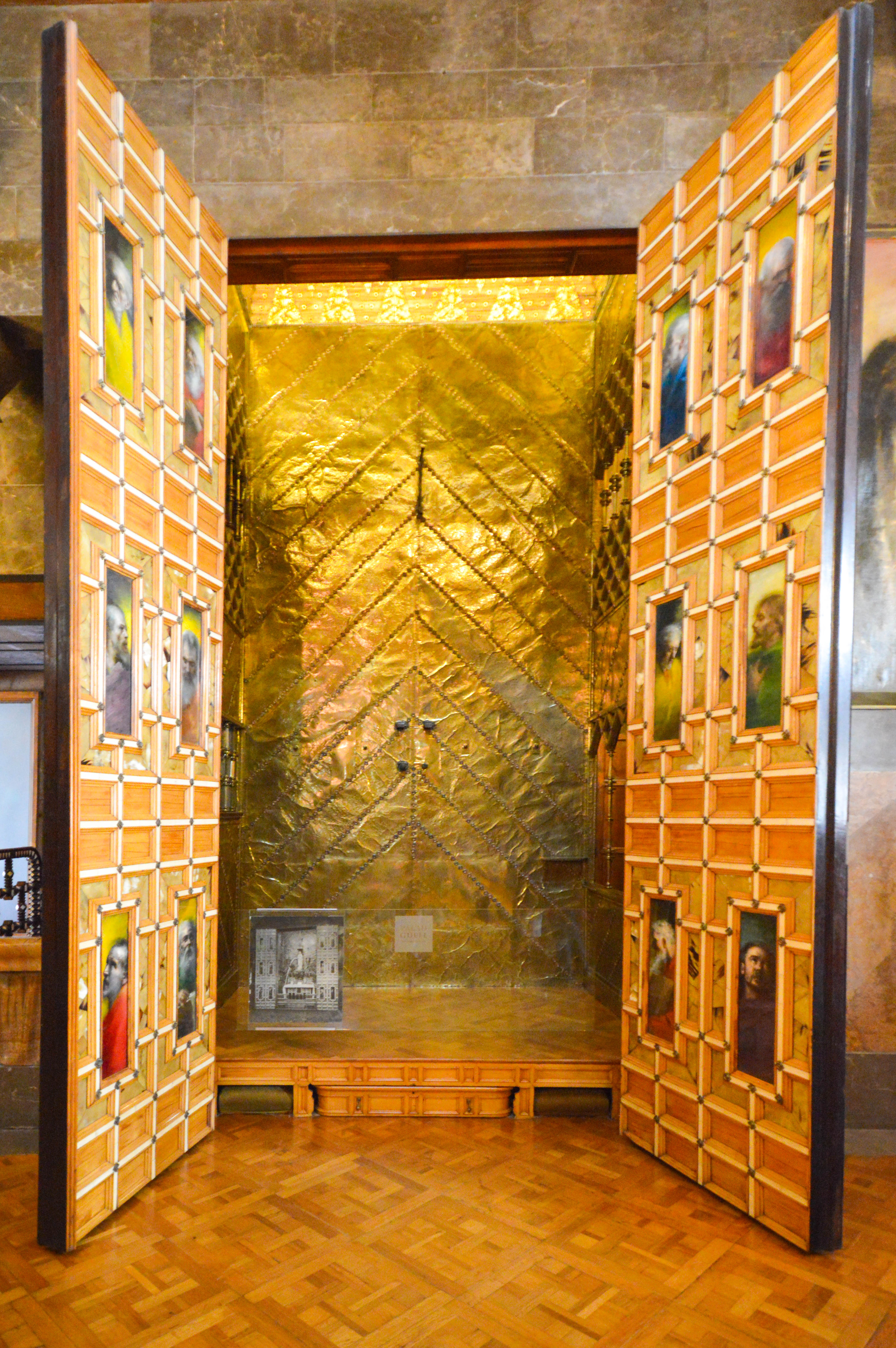 a room with golden walls and parquet flooring