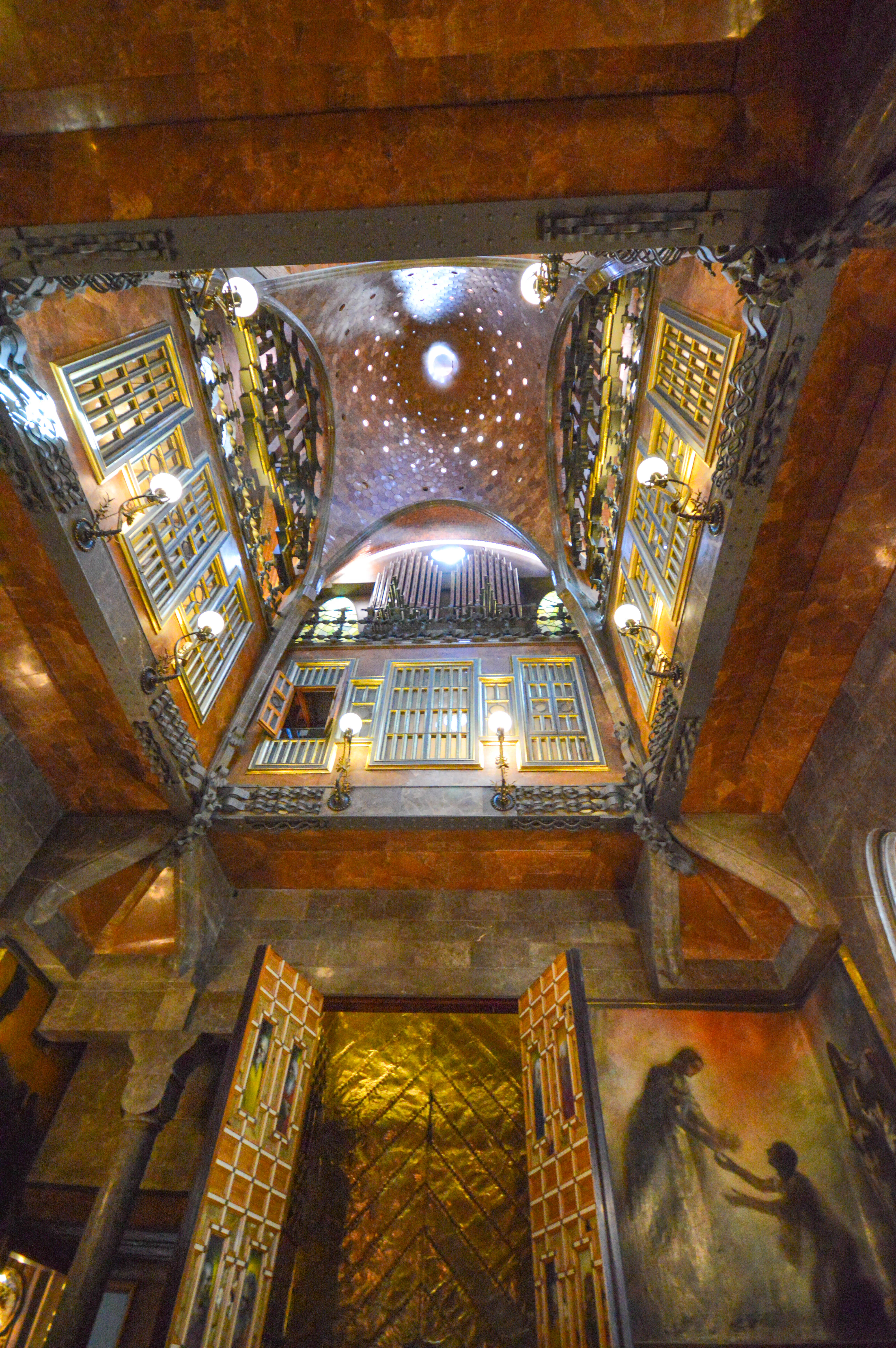 The ceiling is adorned with intricate designs and a starry night sky effect