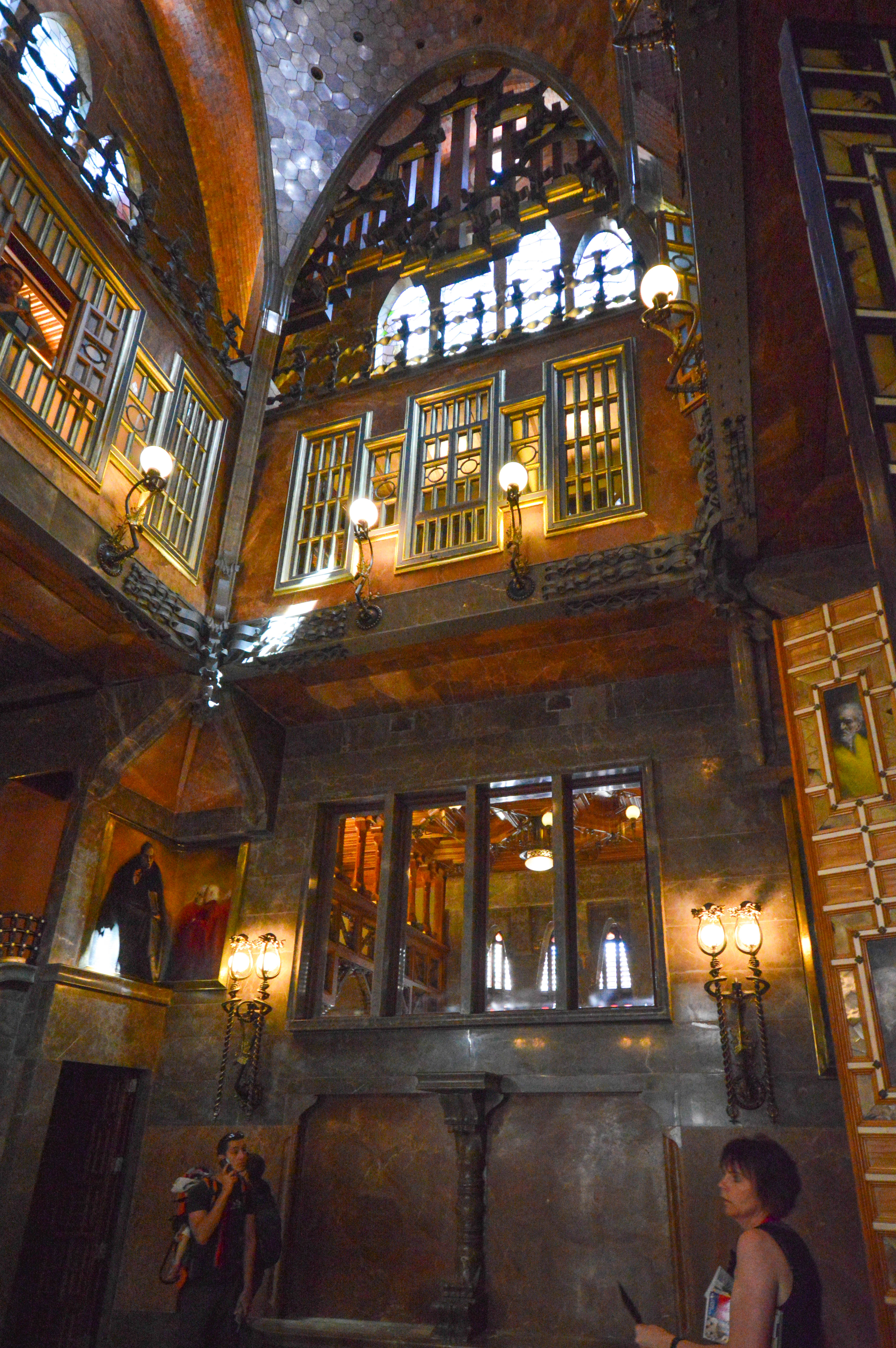 The space features multiple levels with large windows and stained glass