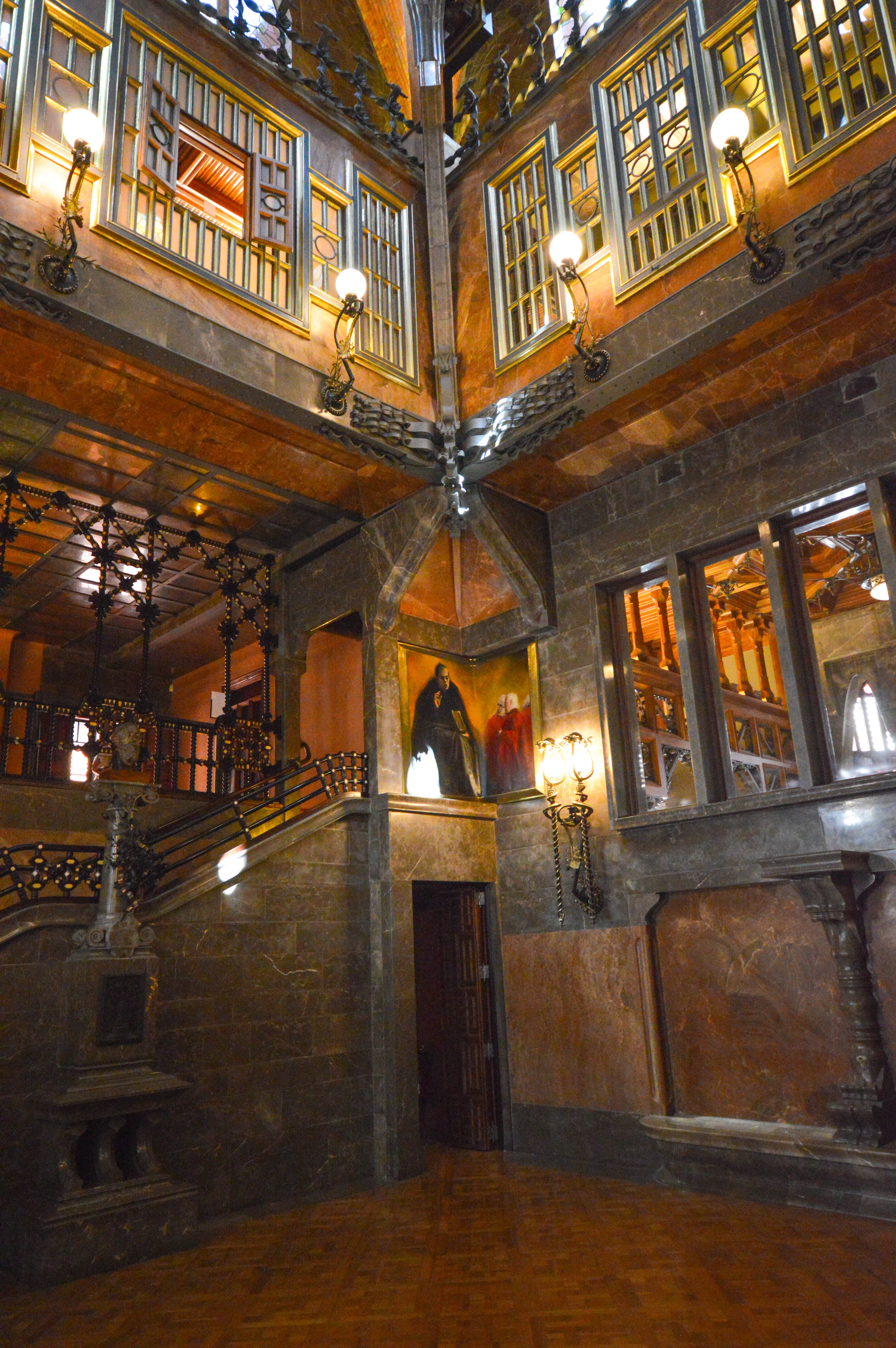 the upper levels have large, multi-paned windows with wooden frames