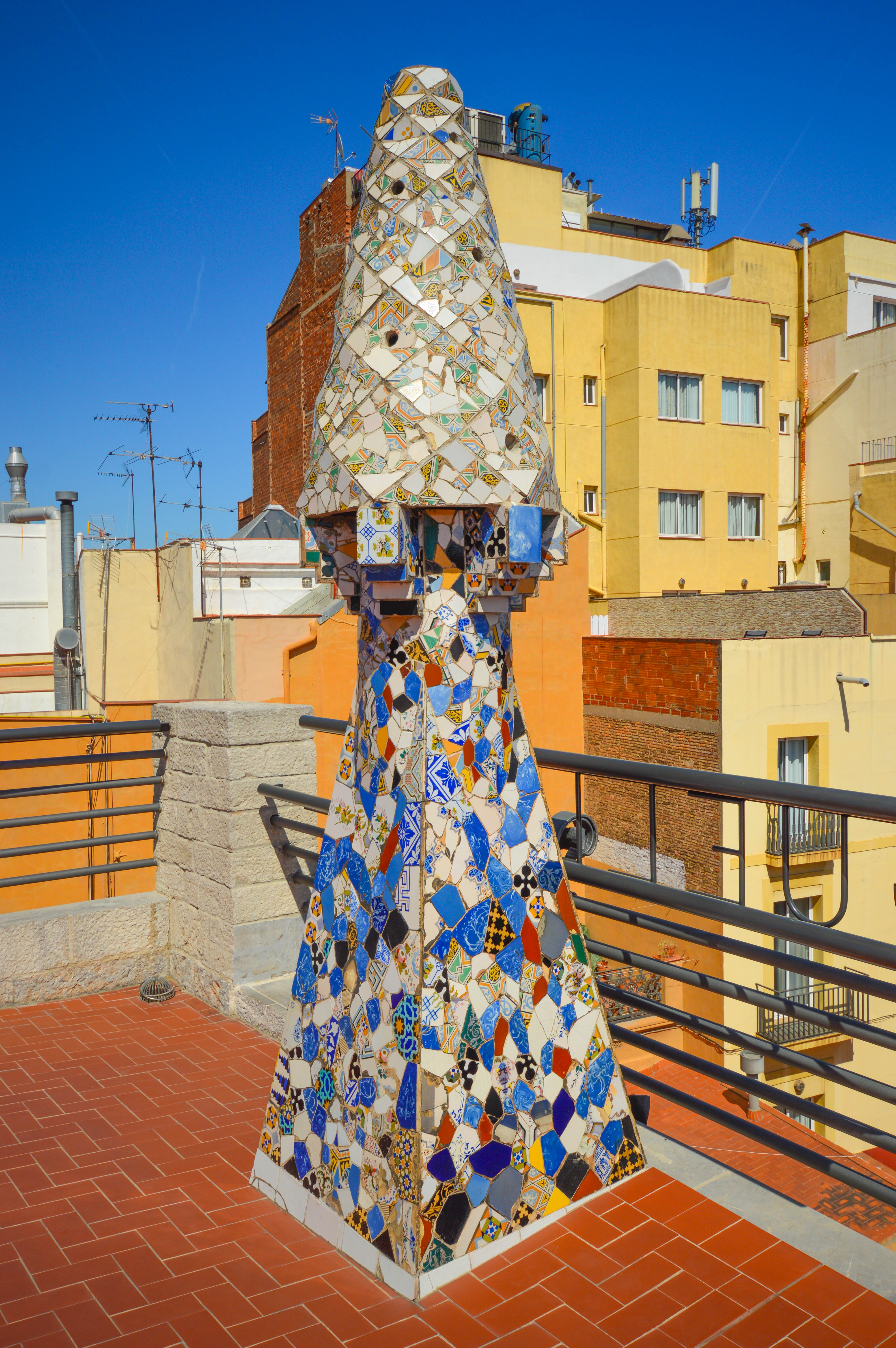 a colorful, mosaic-covered structure on a rooftop