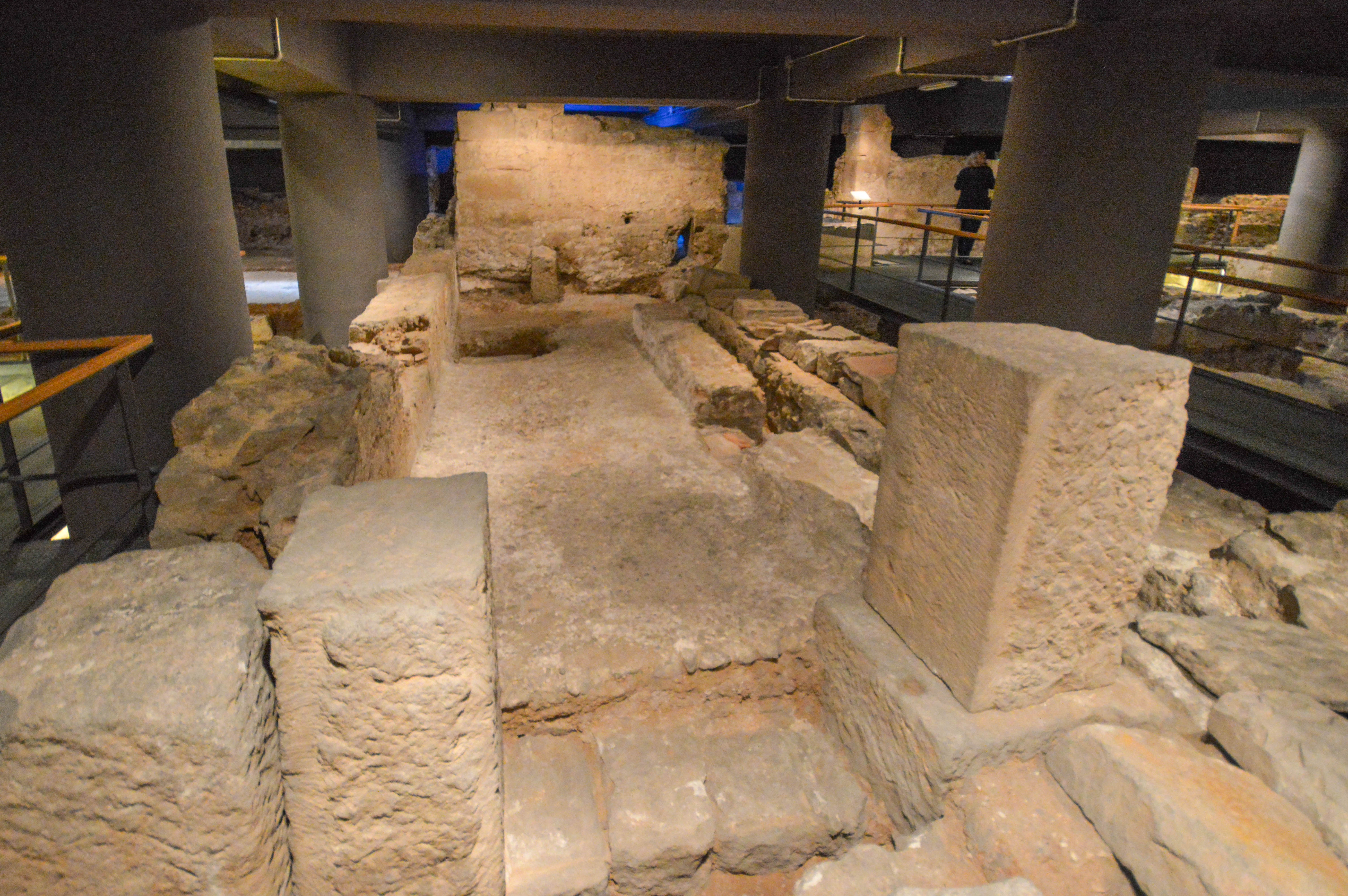 archaeological site with ancient stone structures and ruins