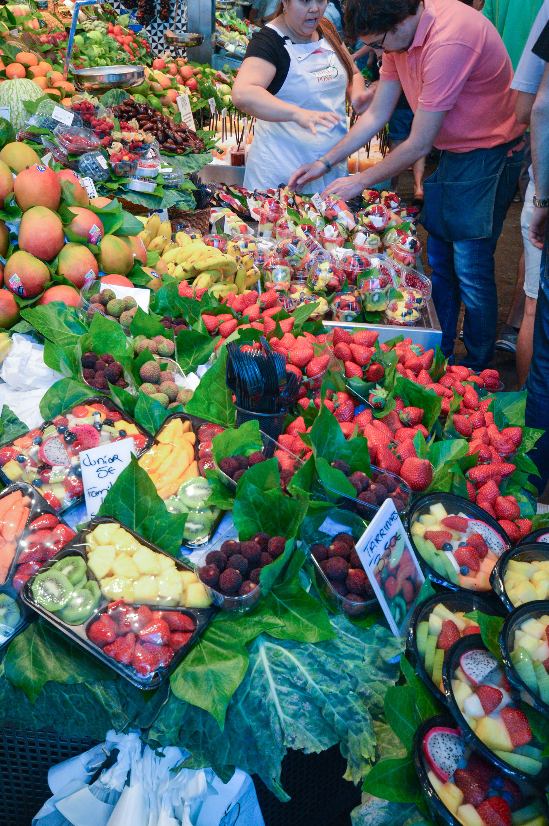 market stall filled with a variety of fresh fruits