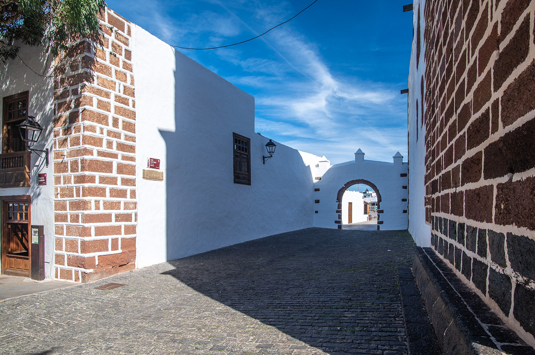 whitewashed walls and dark brown brick accents