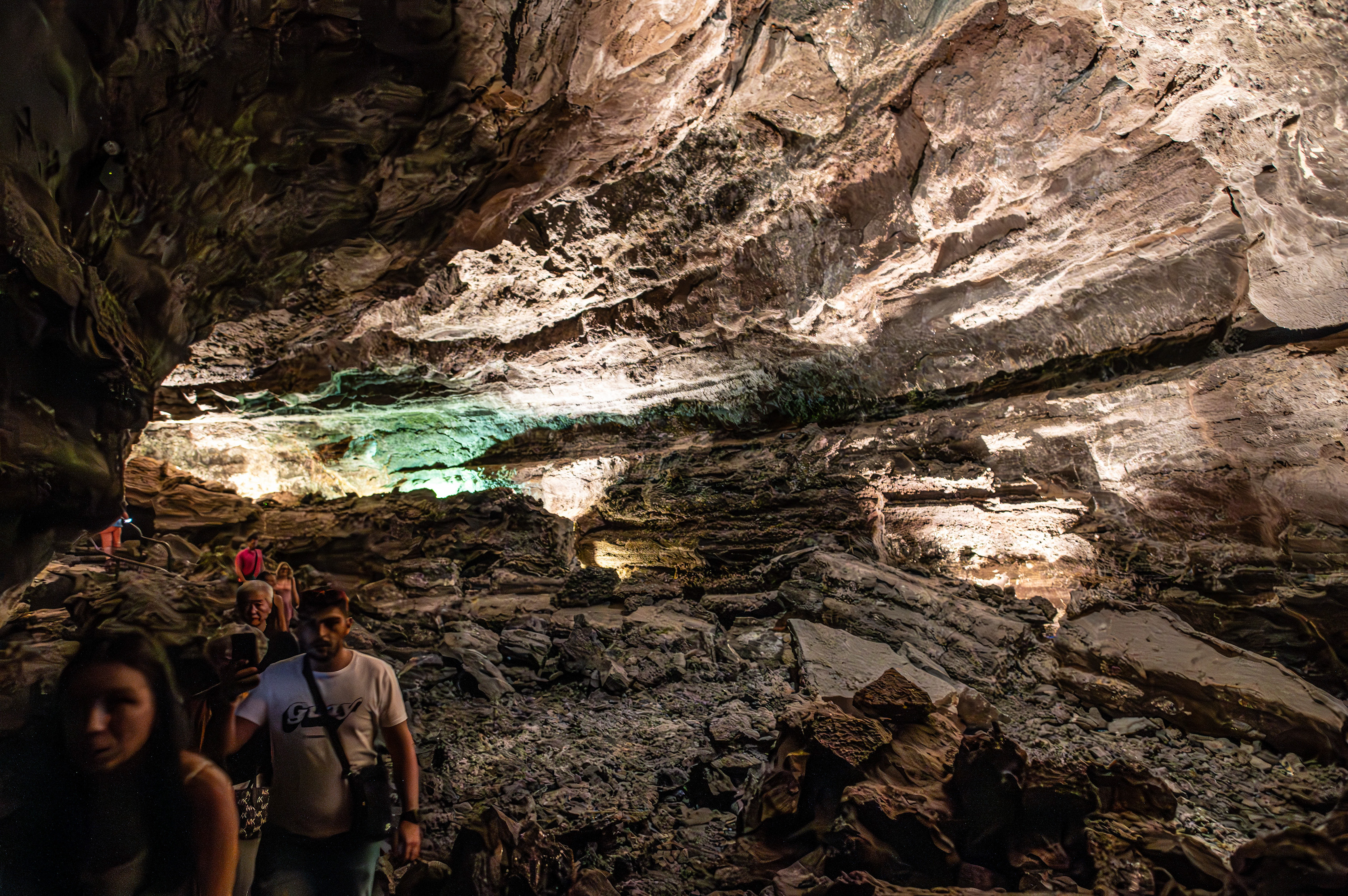 a group of people exploring a cave