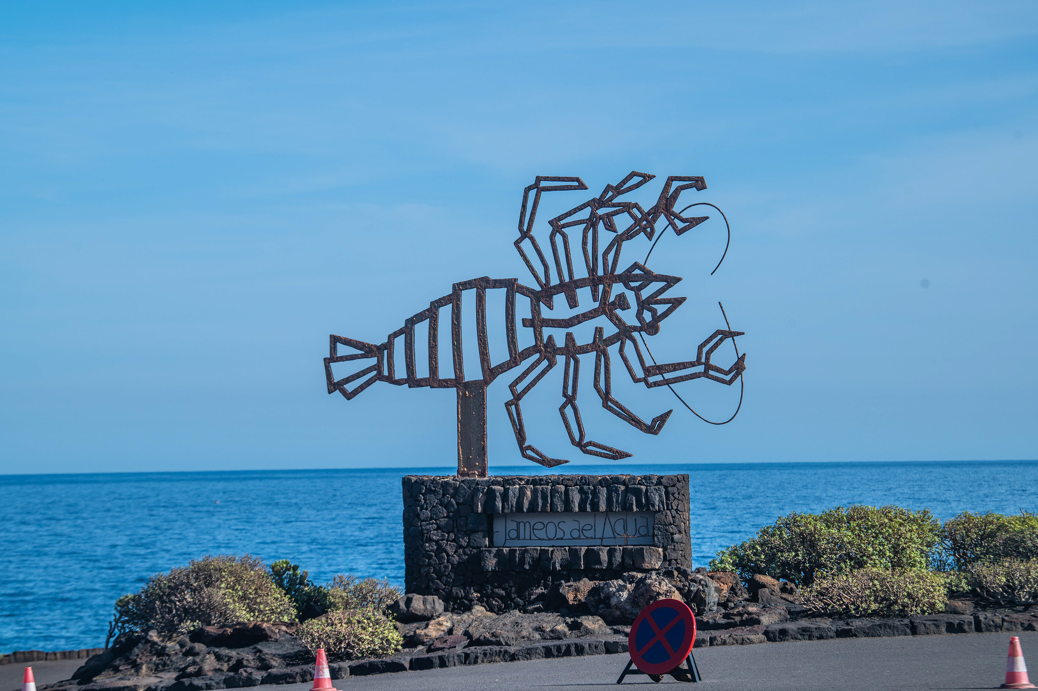 a metal sculpture of a fish