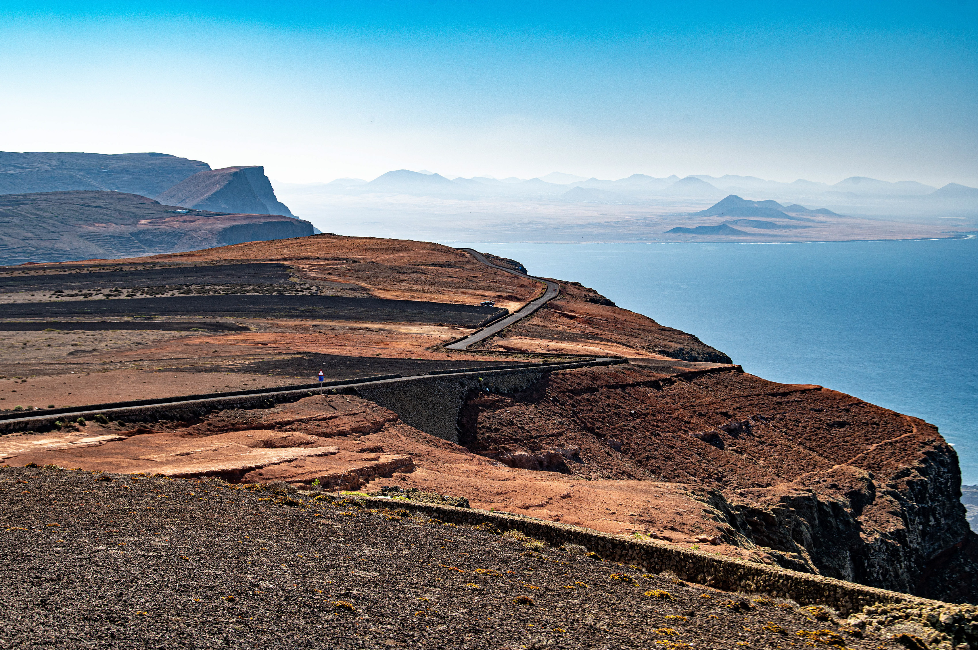 the background features distant mountains shrouded in mist