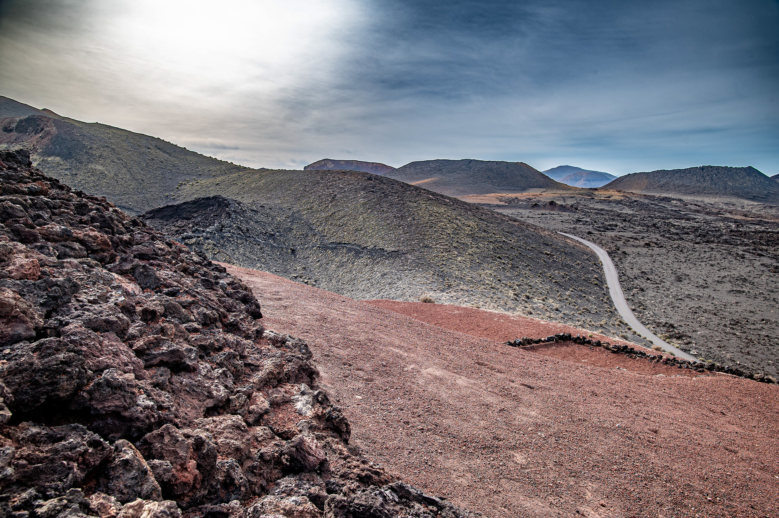 The terrain is characterized by rocky, volcanic soil and sparse vegetation