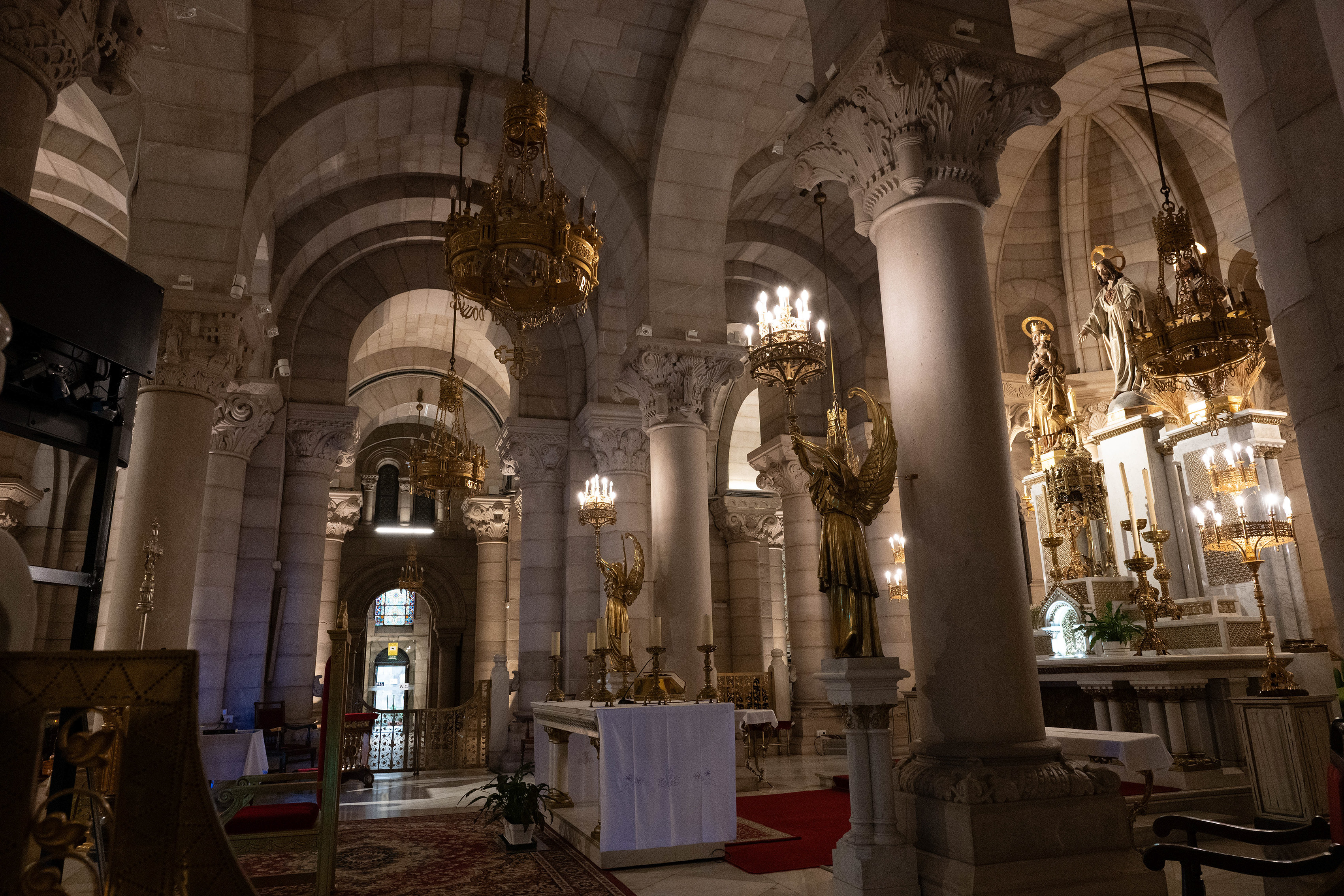 The space is dimly lit, creating a solemn and reverent atmosphere