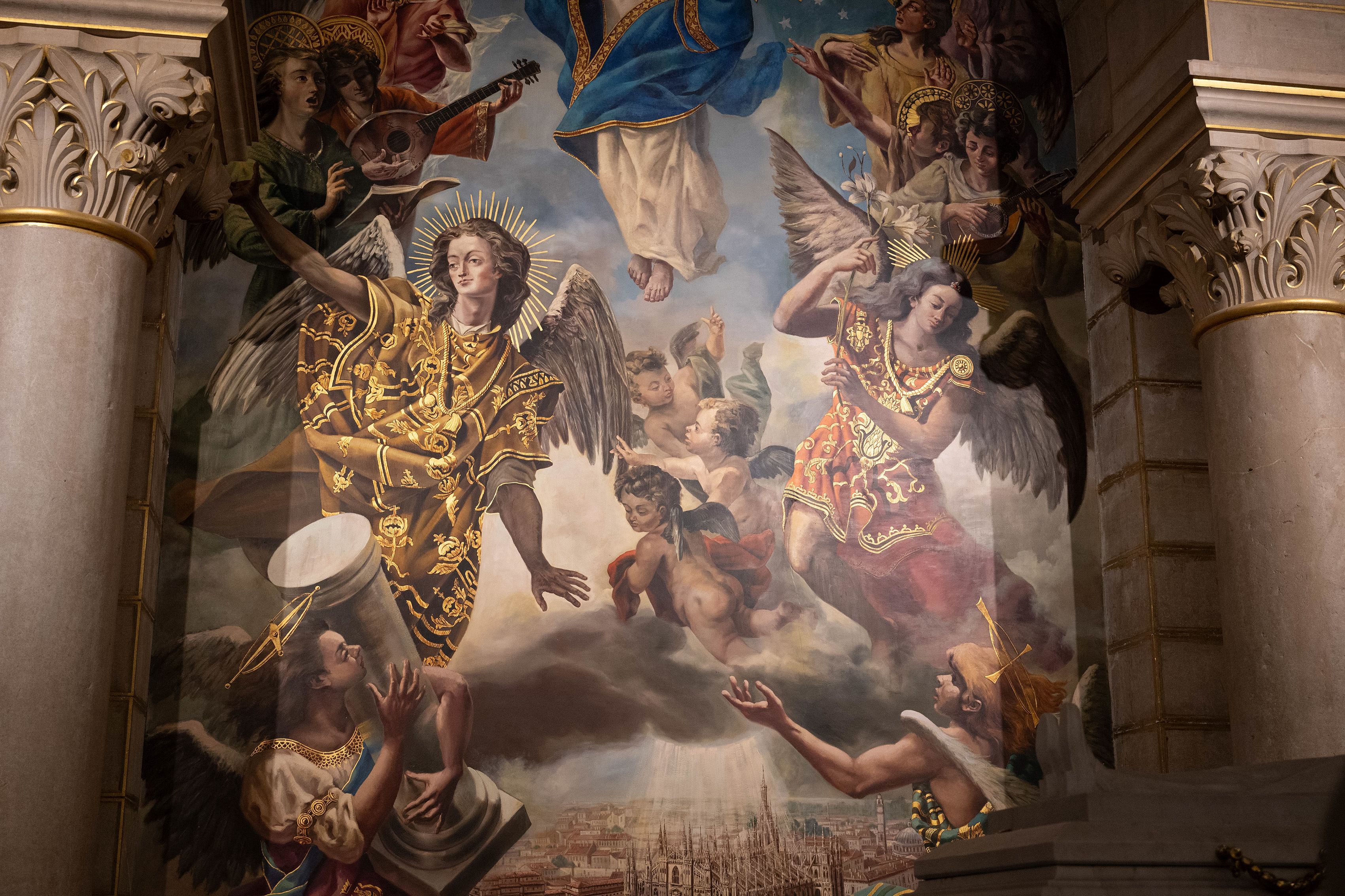  a religious fresco featuring angels with musical instruments