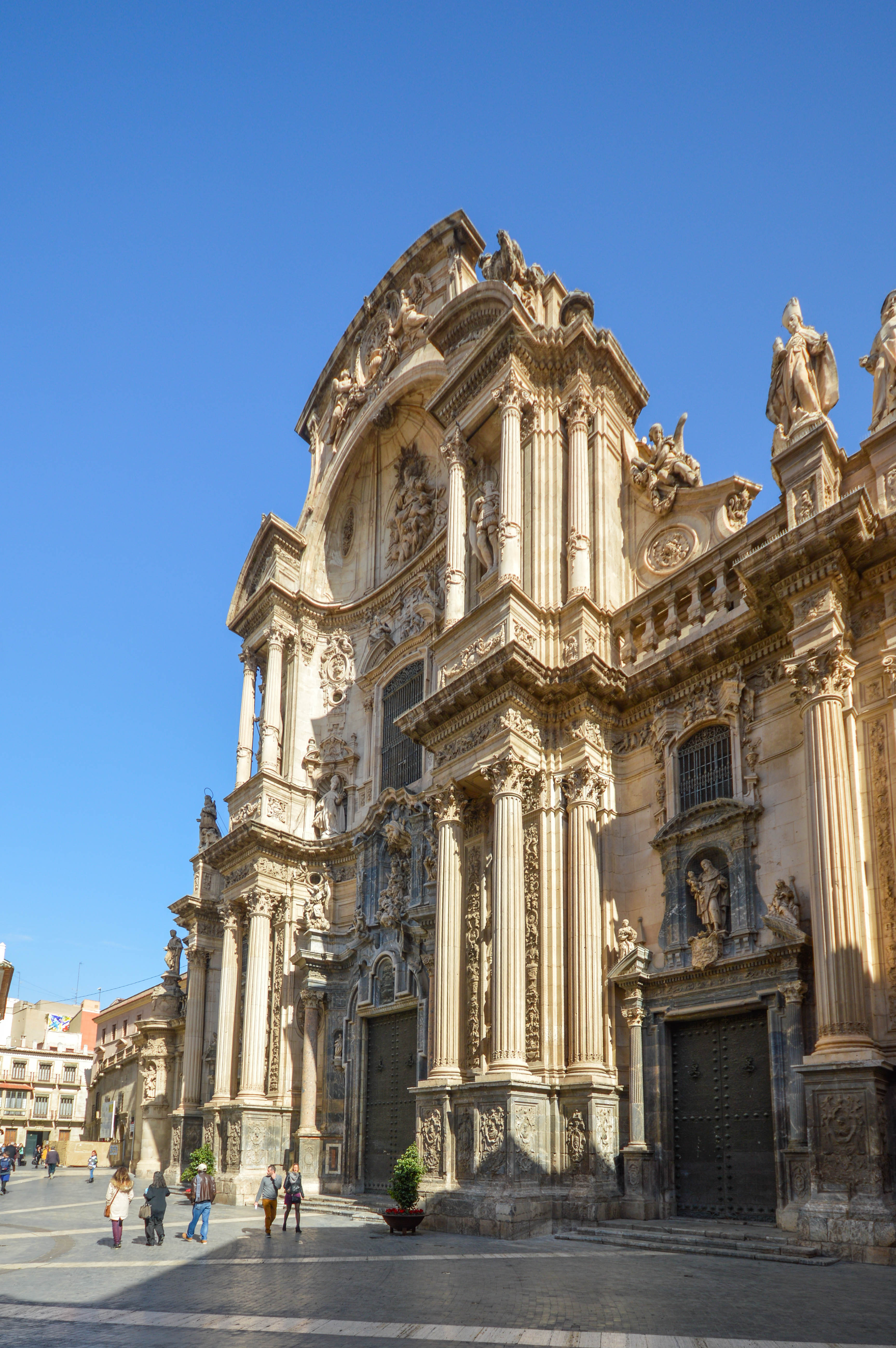  The facade features elaborate carvings, statues, and columns