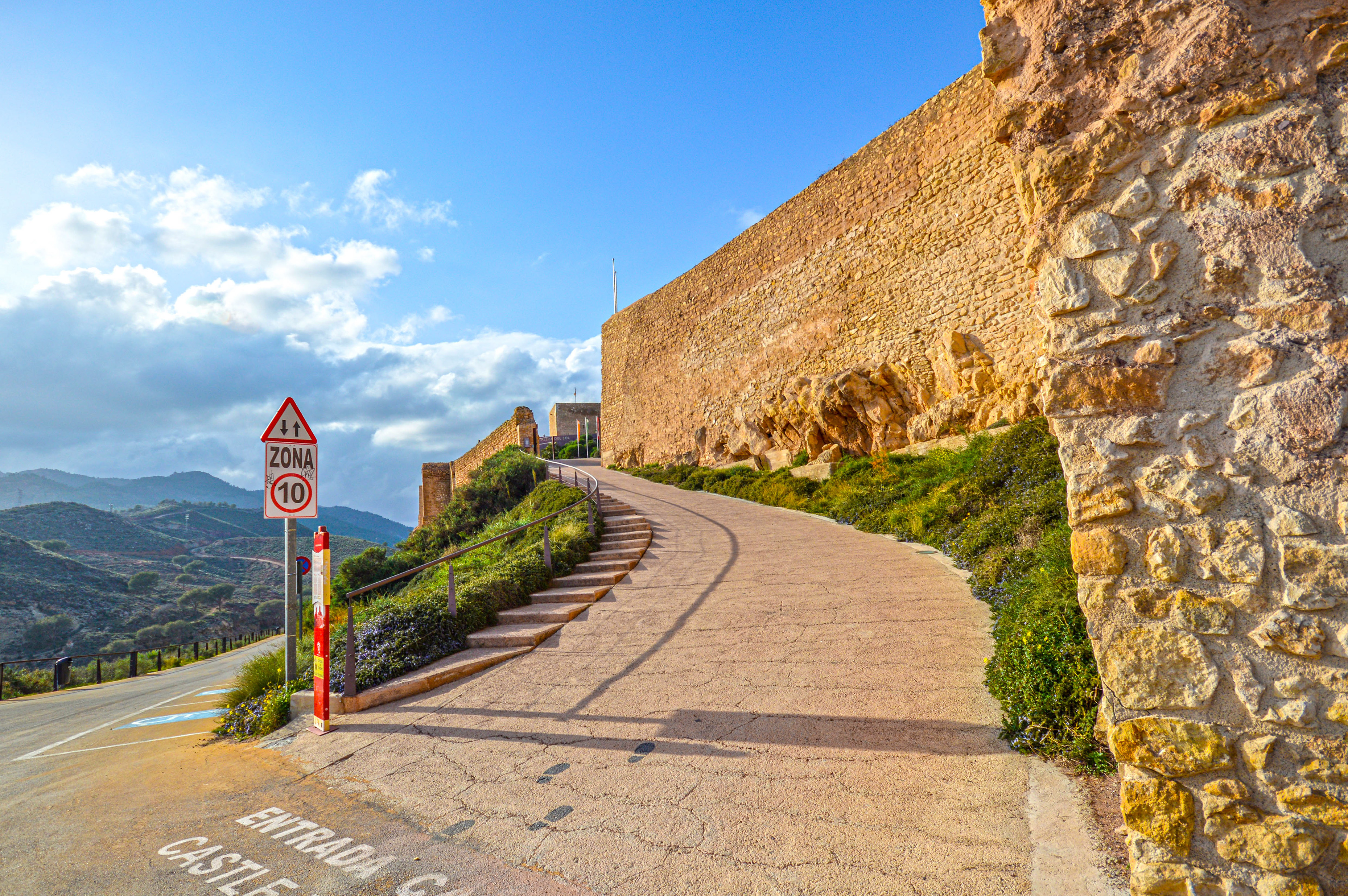 a scenic view of rolling hills and a clear sky