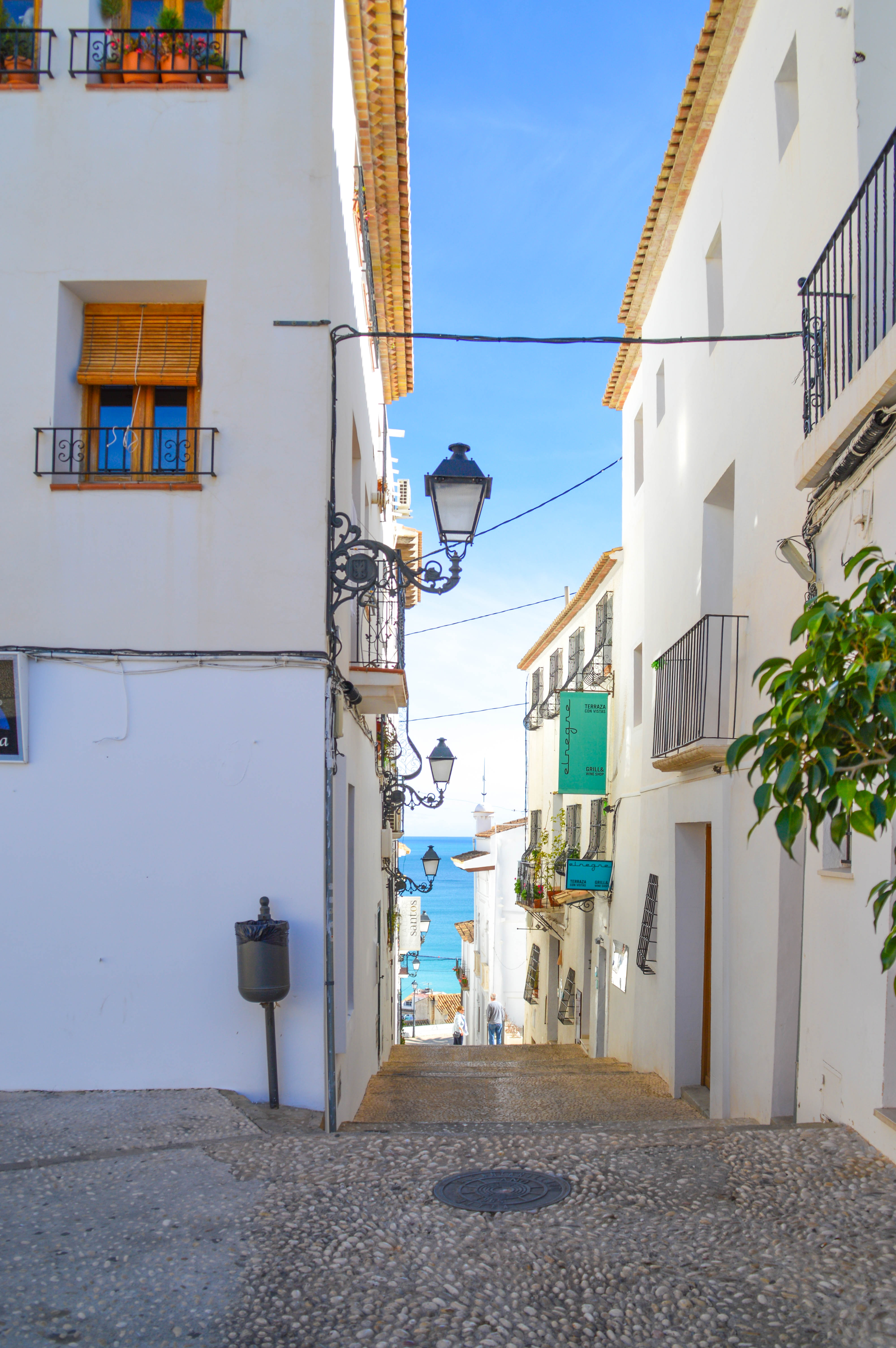 a Mediterranean town, characterized by white-washed buildings with terracotta roof tiles