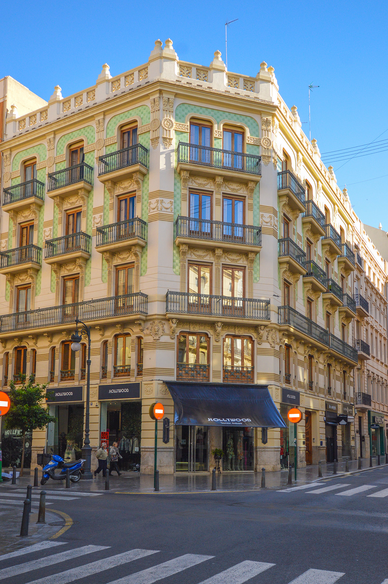 a street corner in a city with a prominent, ornate building