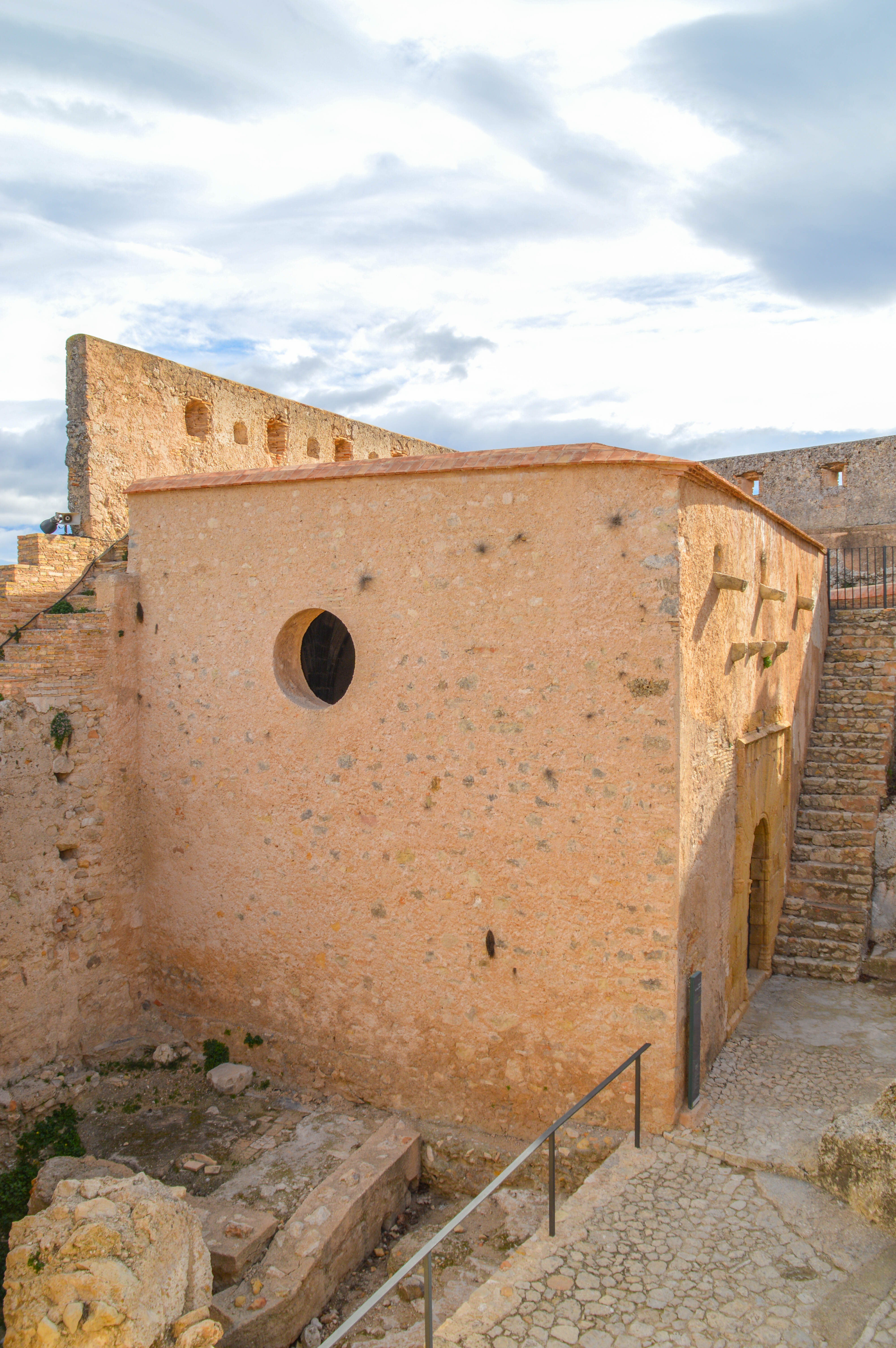 a large, round window on one wall