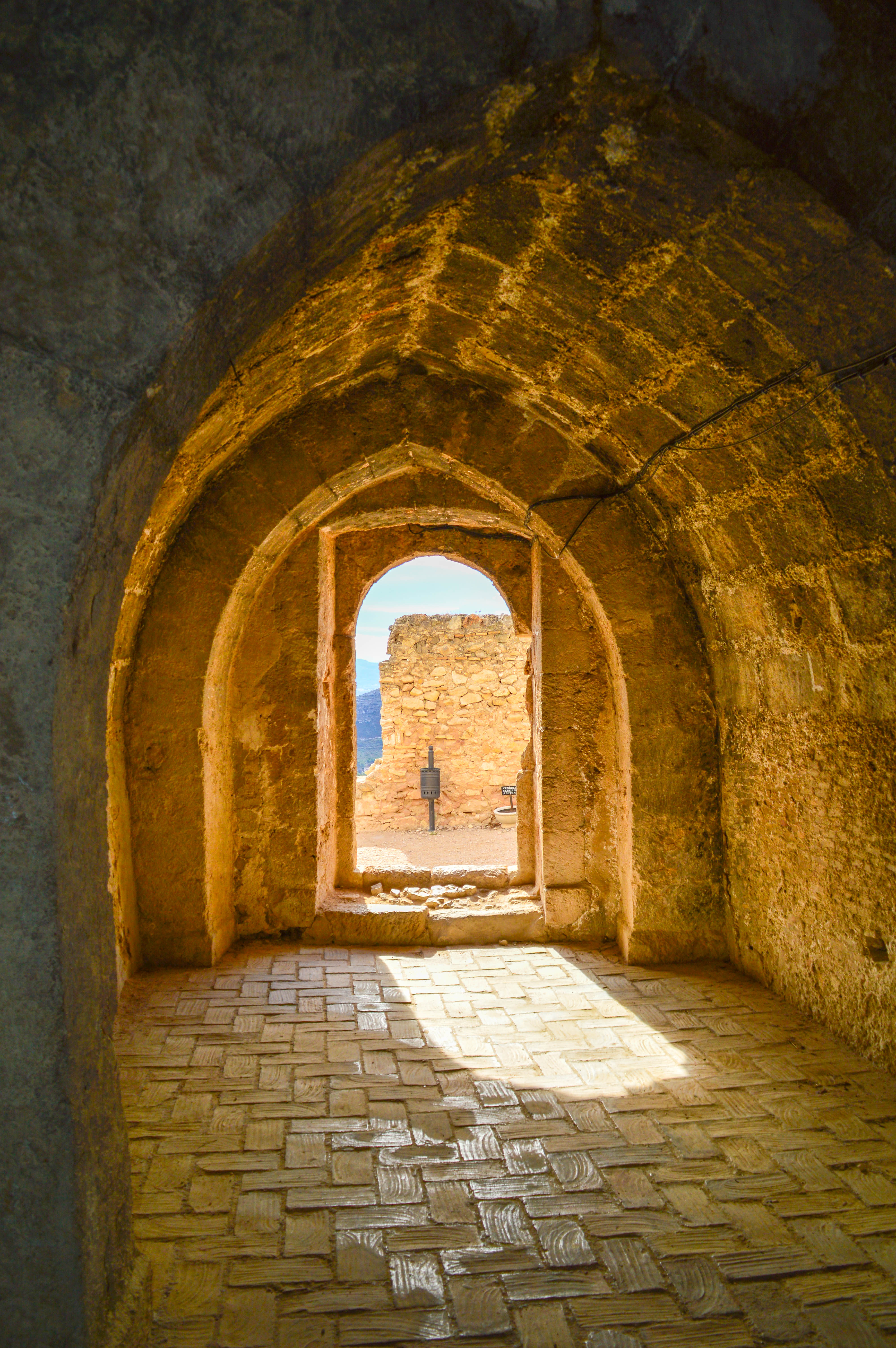 n arched doorway leading to an outdoor area