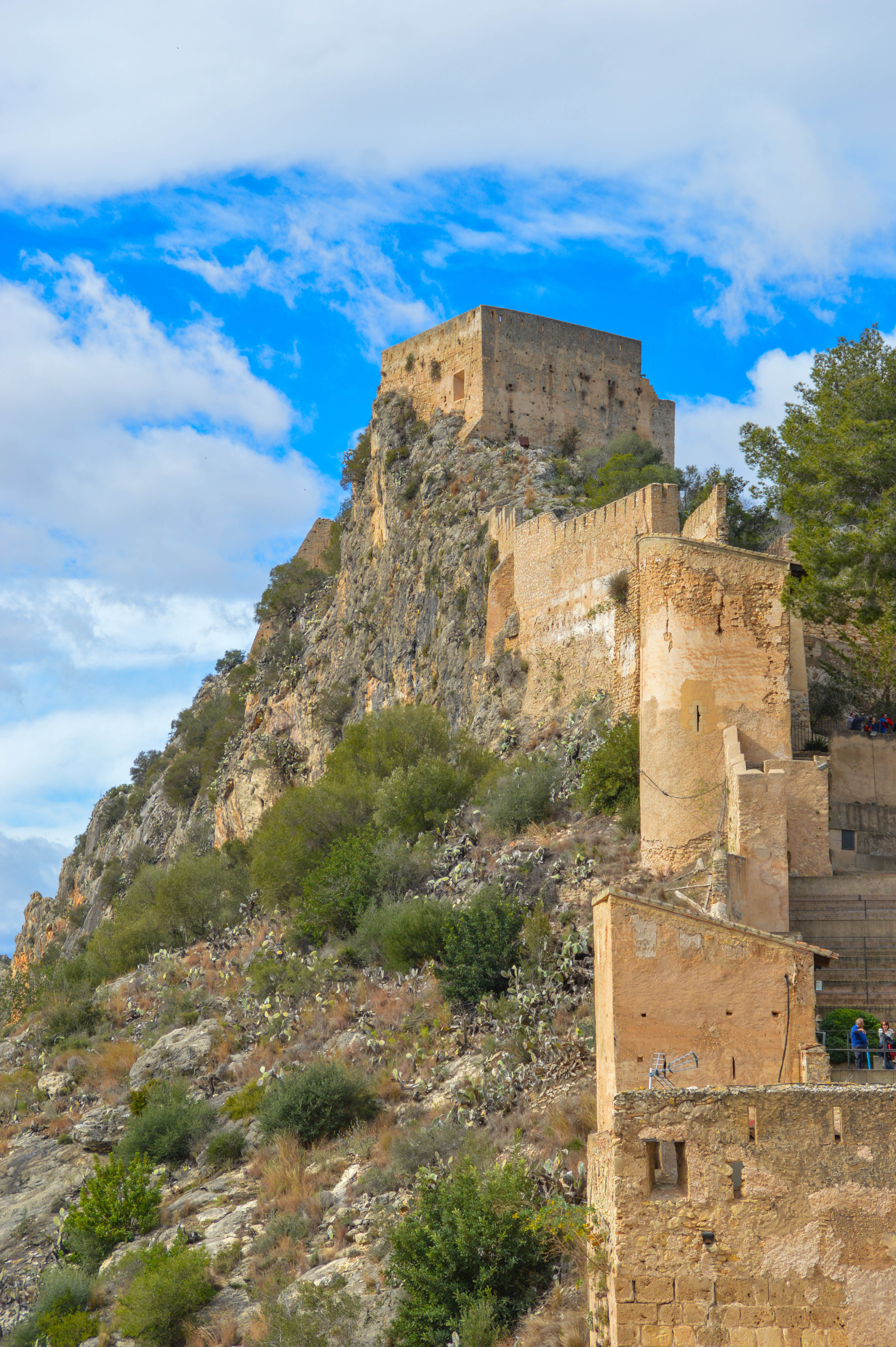 fortress or castle built on a rocky hillsid