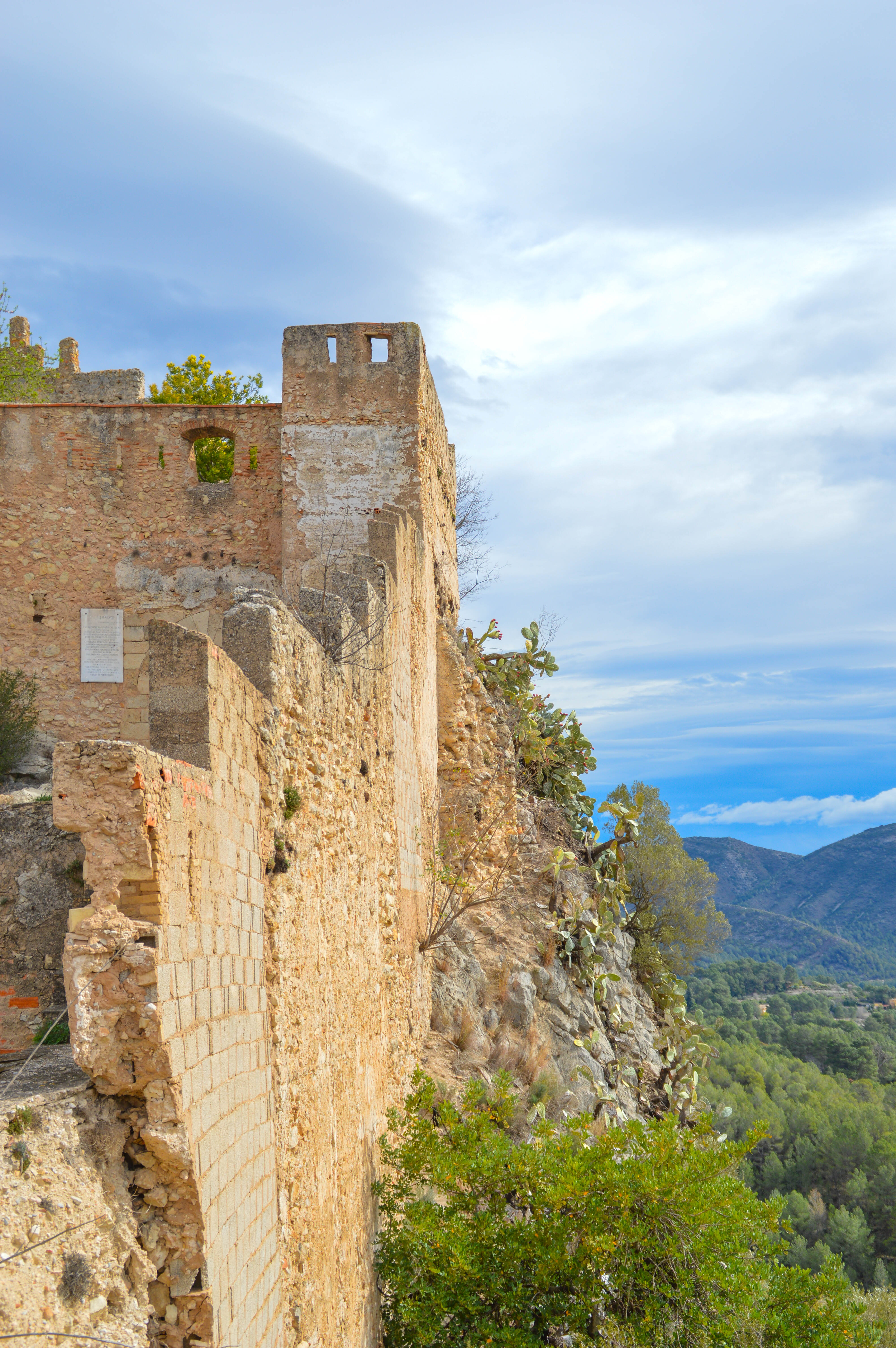 castle wall situated on a cliffside