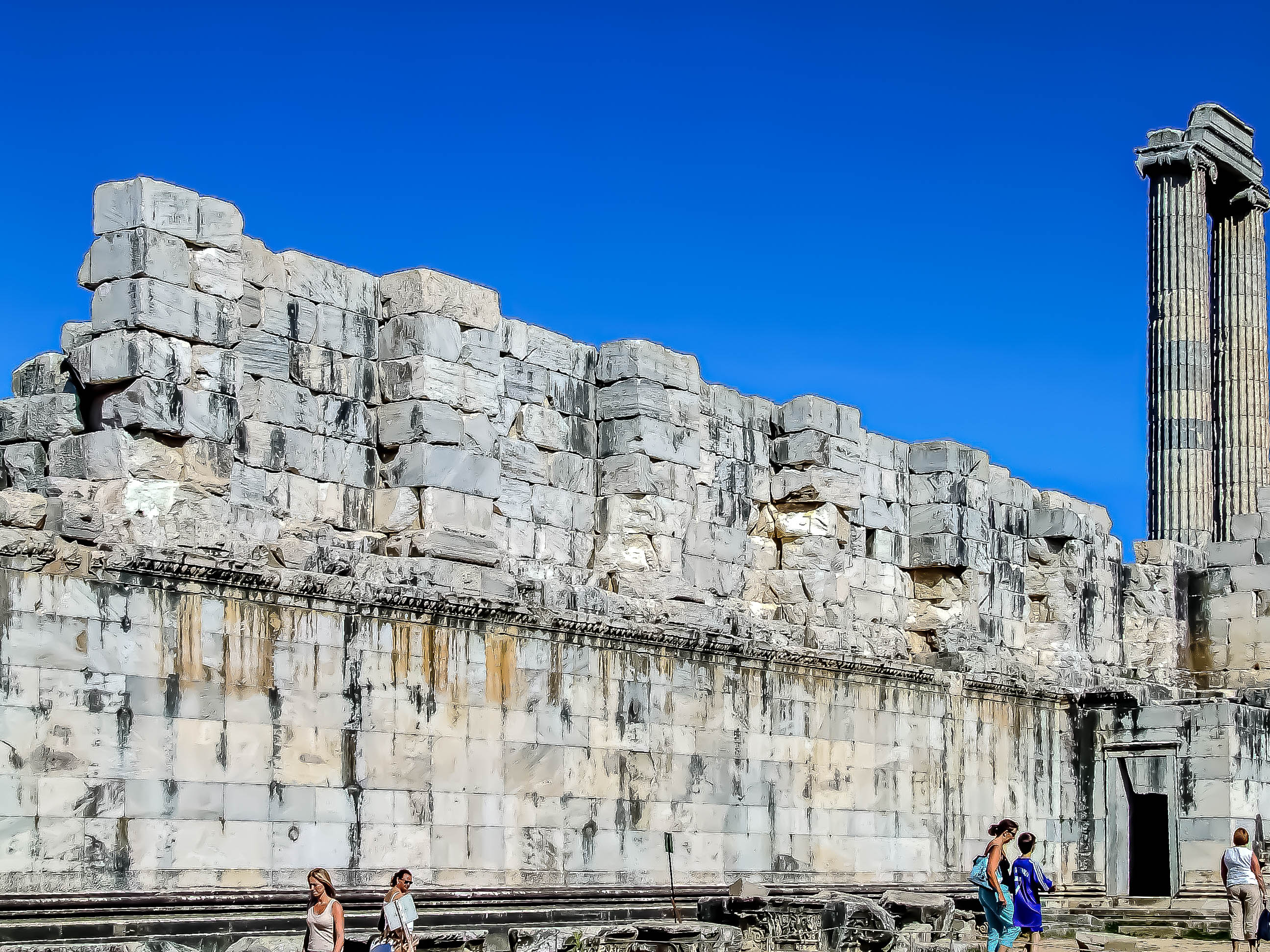 Several columns, some of which are still standing while others are in ruins, are visible.
