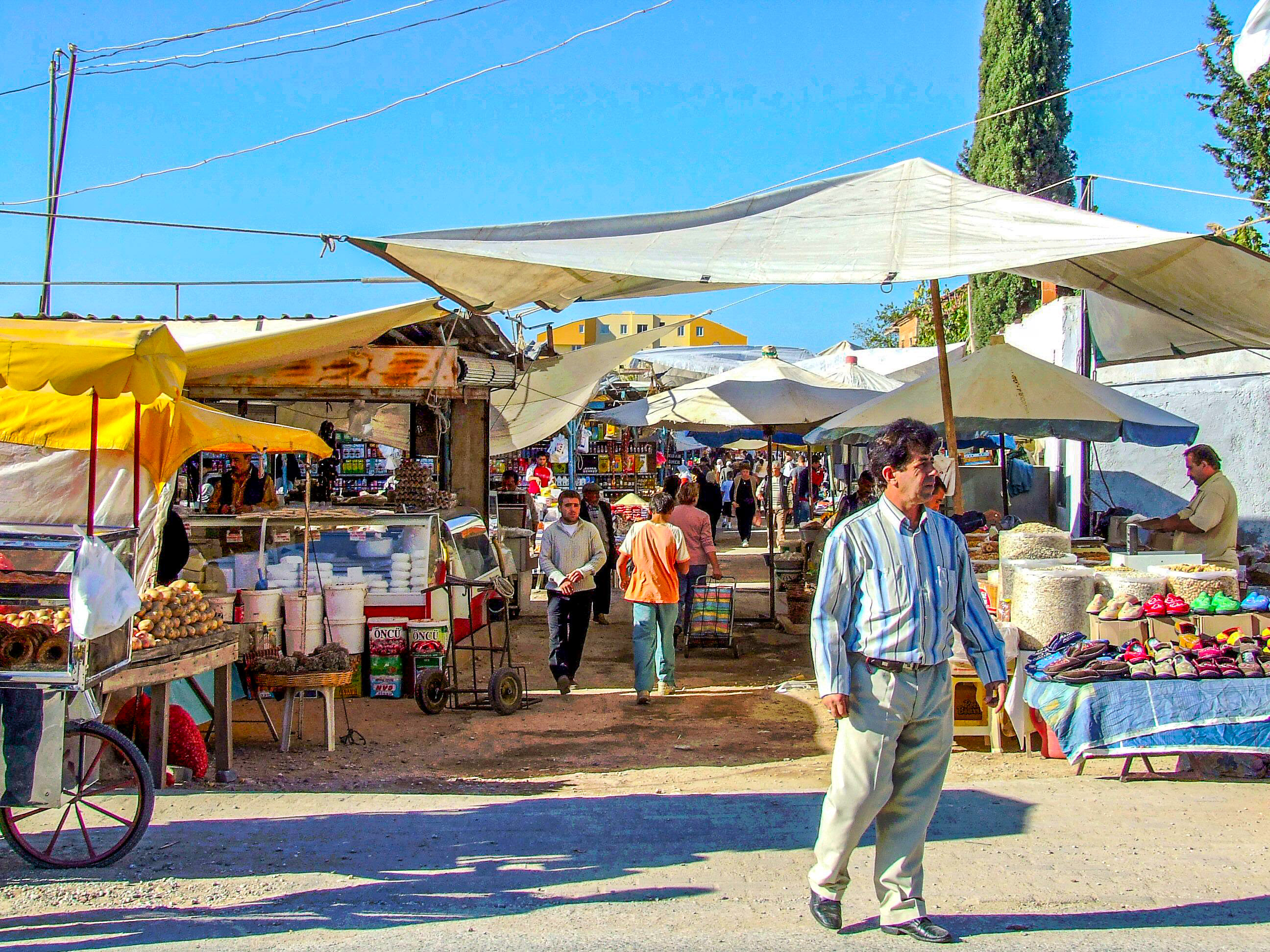 Vendors and shoppers are seen engaging
