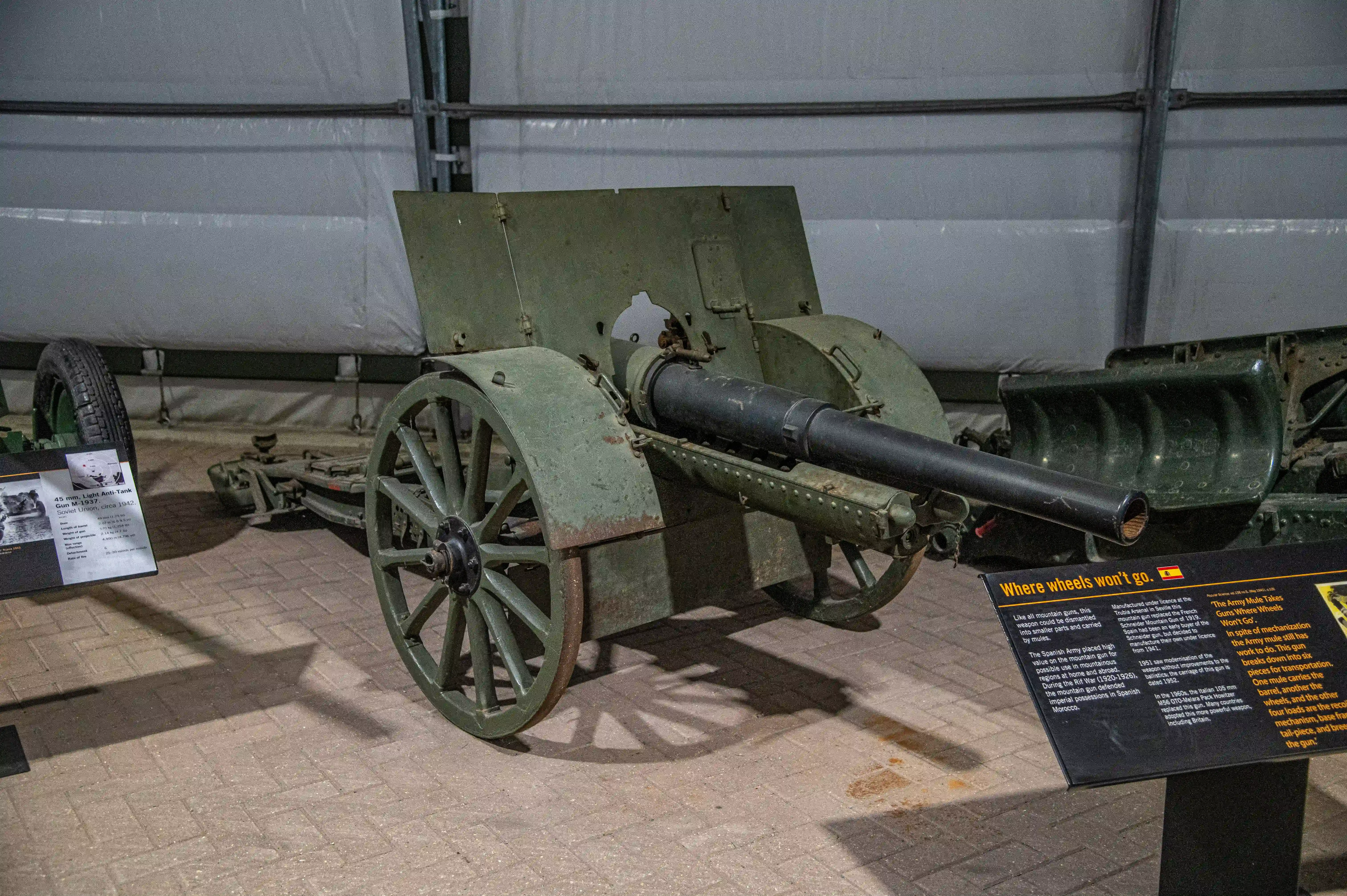 The document describes various artillery pieces and their historical uses. It highlights the 45 mm Light Anti-Tank Gun M1937 used by the Soviet Union during World War II, noting its effectiveness and mobility. It also mentions the Pack Howitzer used by the British Army in World War I, which could be broken down for transport by mules. Additionally, it discusses the Army Mule Mountain Gun, which was used in mountainous terrain during the Rif War. Overall, the text emphasizes the importance of mobility and adaptability in artillery design.