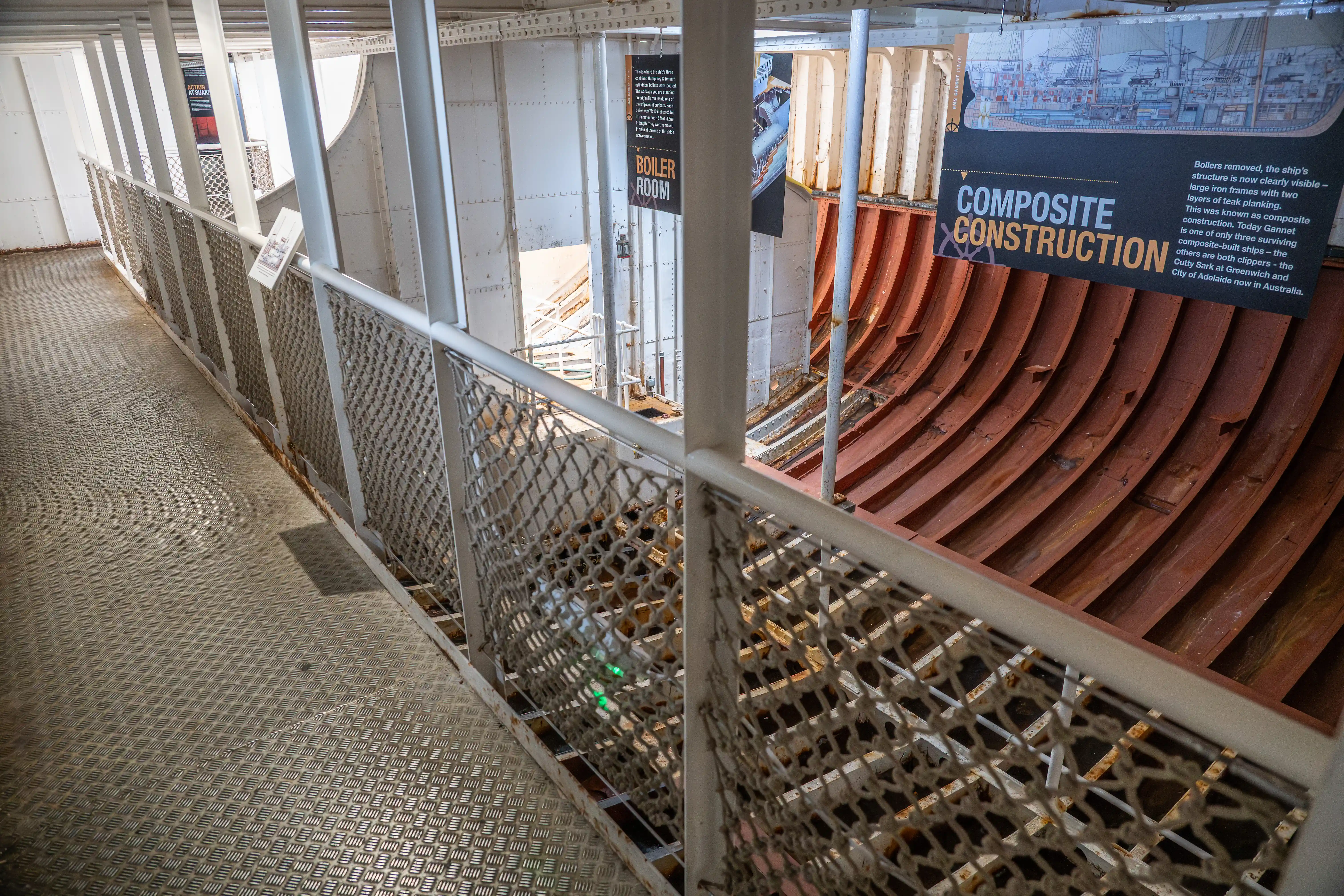The document describes the process of composite construction used in shipbuilding. It mentions that boilers have been removed, revealing the ship's structure with large iron frames and layers of teak planking. This method is known as composite construction, and today, only a few composite-built ships survive, including notable examples like the Cutty Sark in Greenwich and the City of Adelaide in Australia.