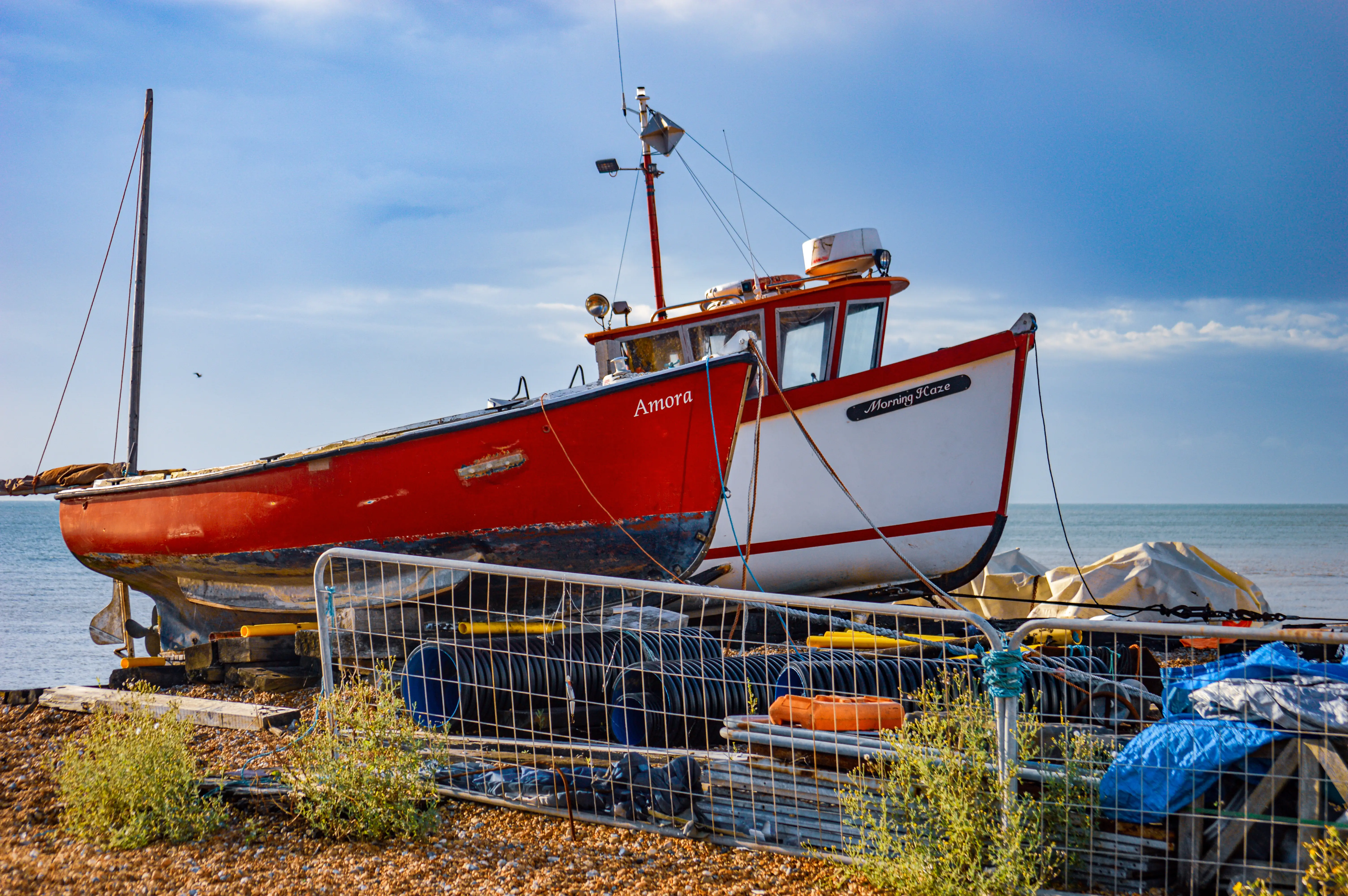 Two colourful fishing boats named 