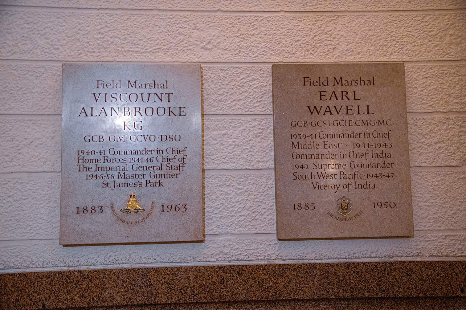 The image shows two plaques commemorating Field Marshals. The left plaque is for Field Marshal Viscount Alan Brooke, KG, GCB, OM, GCVO, DSO, who served as Commander-in-Chief of Home Forces (1940-41), Chief of the Imperial General Staff (1941-46), and Master Gunner of St. James's Park (1946-56). The right plaque is for Field Marshal Earl Wavell, GCB, GCS, GCIE, CMG, MC, who served as Commander-in-Chief in the Middle East (1939-41), Commander-in-Chief in India (1941-43), Supreme Commander South West Pacific (1942), and Viceroy of India (1943-47). Both plaques include their birth and death years, 1883-1963 for Alan Brooke and 1883-1950 for Wavell.