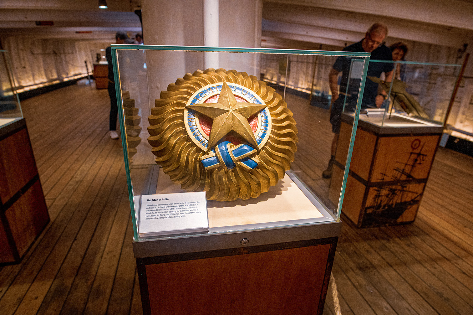 The document describes an artifact known as 'The Star of India,' which is the original stern decoration from the Most Exalted Order of the Star of India ship. This ship was later converted into the HMS Javelin and eventually dismantled in Bombay for the Indian Marine. The artifact is particularly appropriate for a sailing ship and is displayed in a museum.